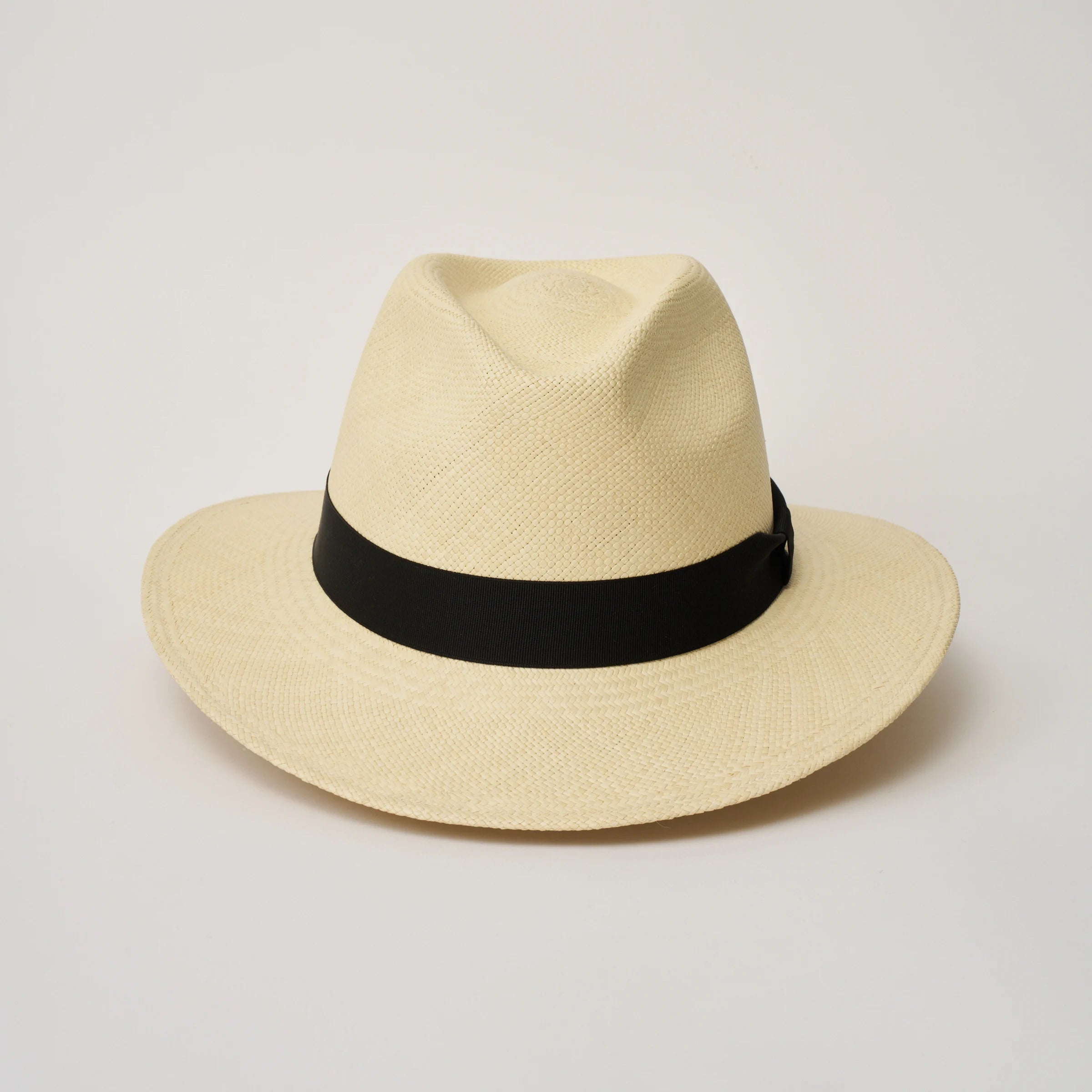 Studio image of the Camilo City Executive Natural coloured Panama Hat with Black trim taken from the front showing pinch and brim.