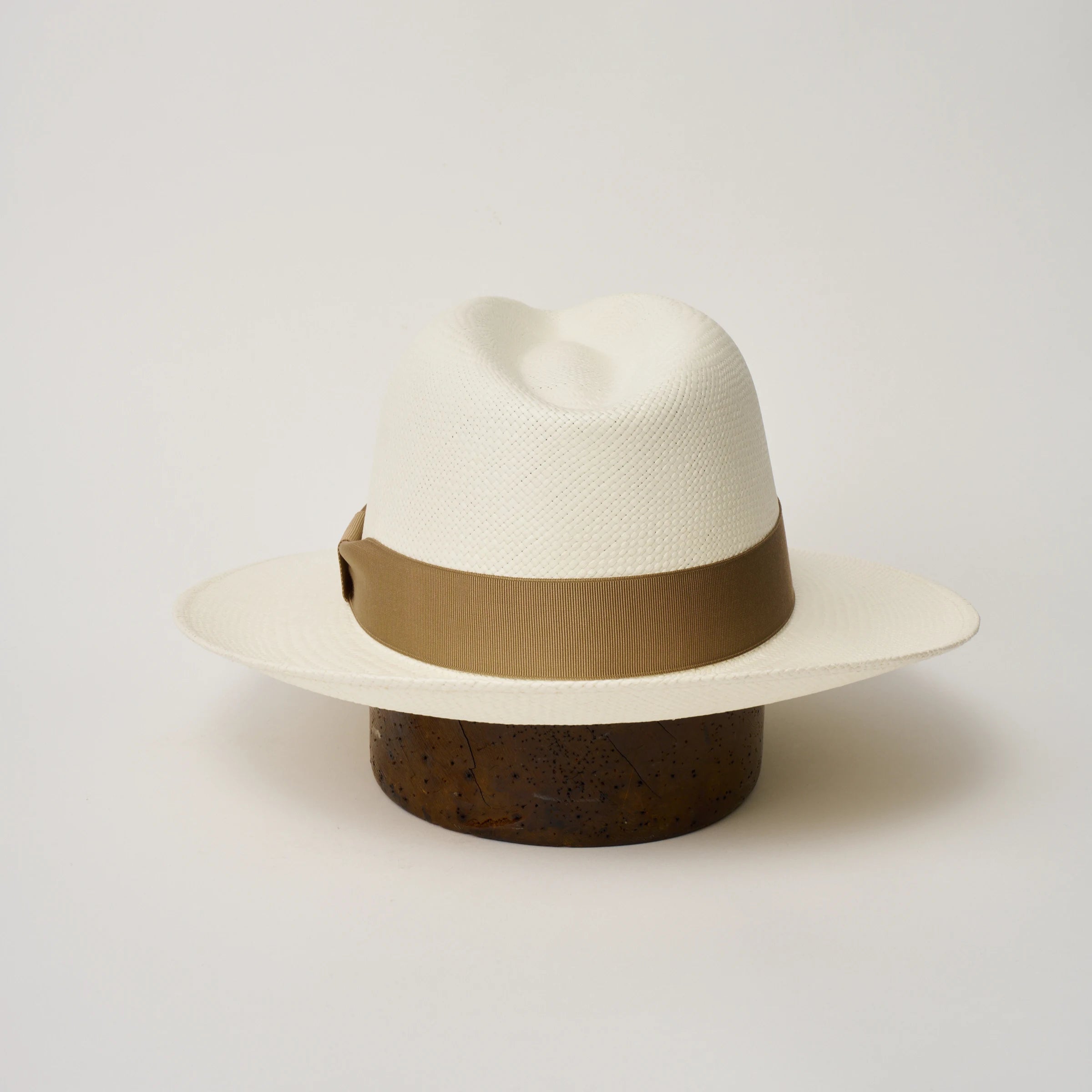Studio image of the Camilo Classic Cream coloured Panama Hat with Tan trim shown from the back, showing the snapback brim.