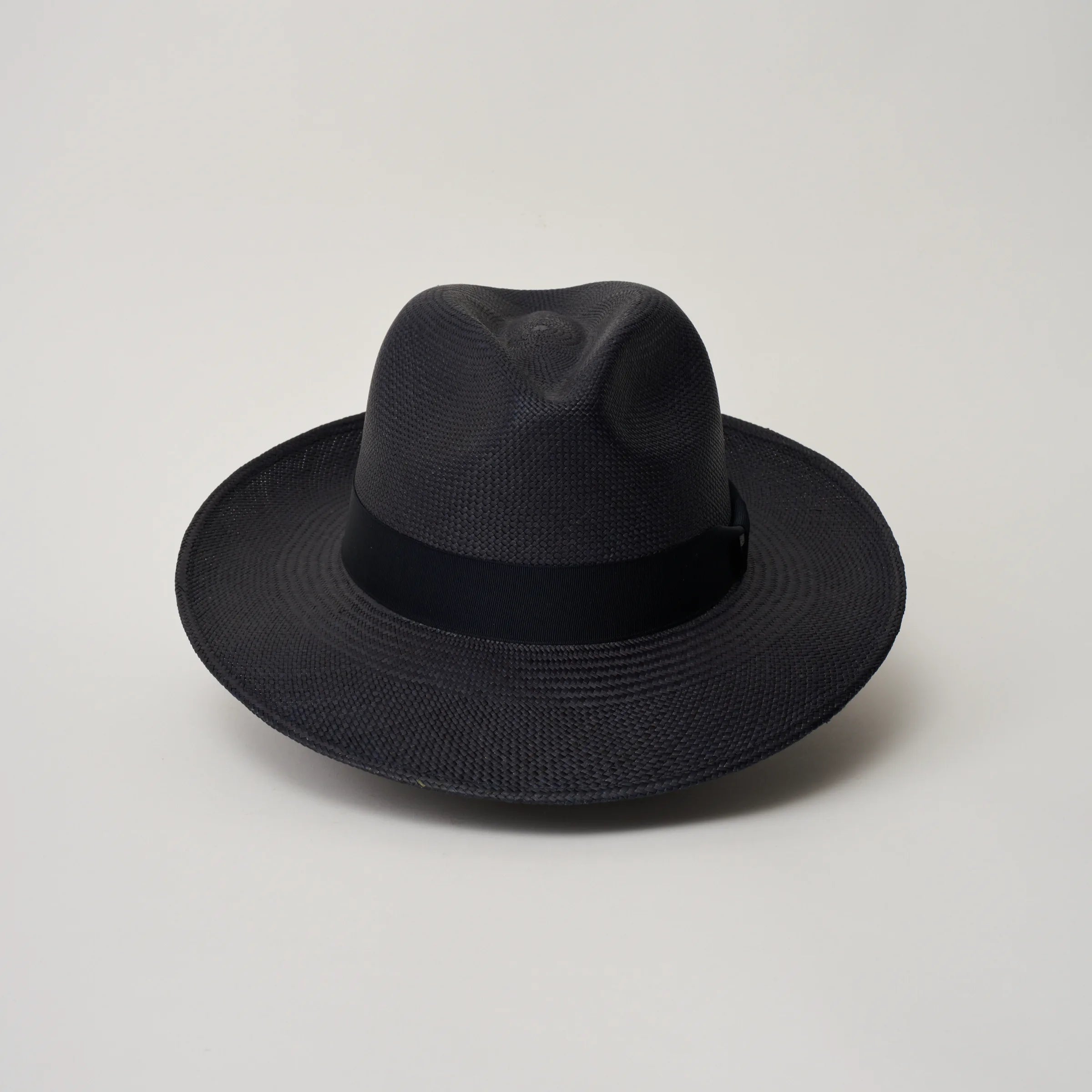 Studio image of the Camilo Classic Navy coloured Panama Hat with Marine trim shown from the front.