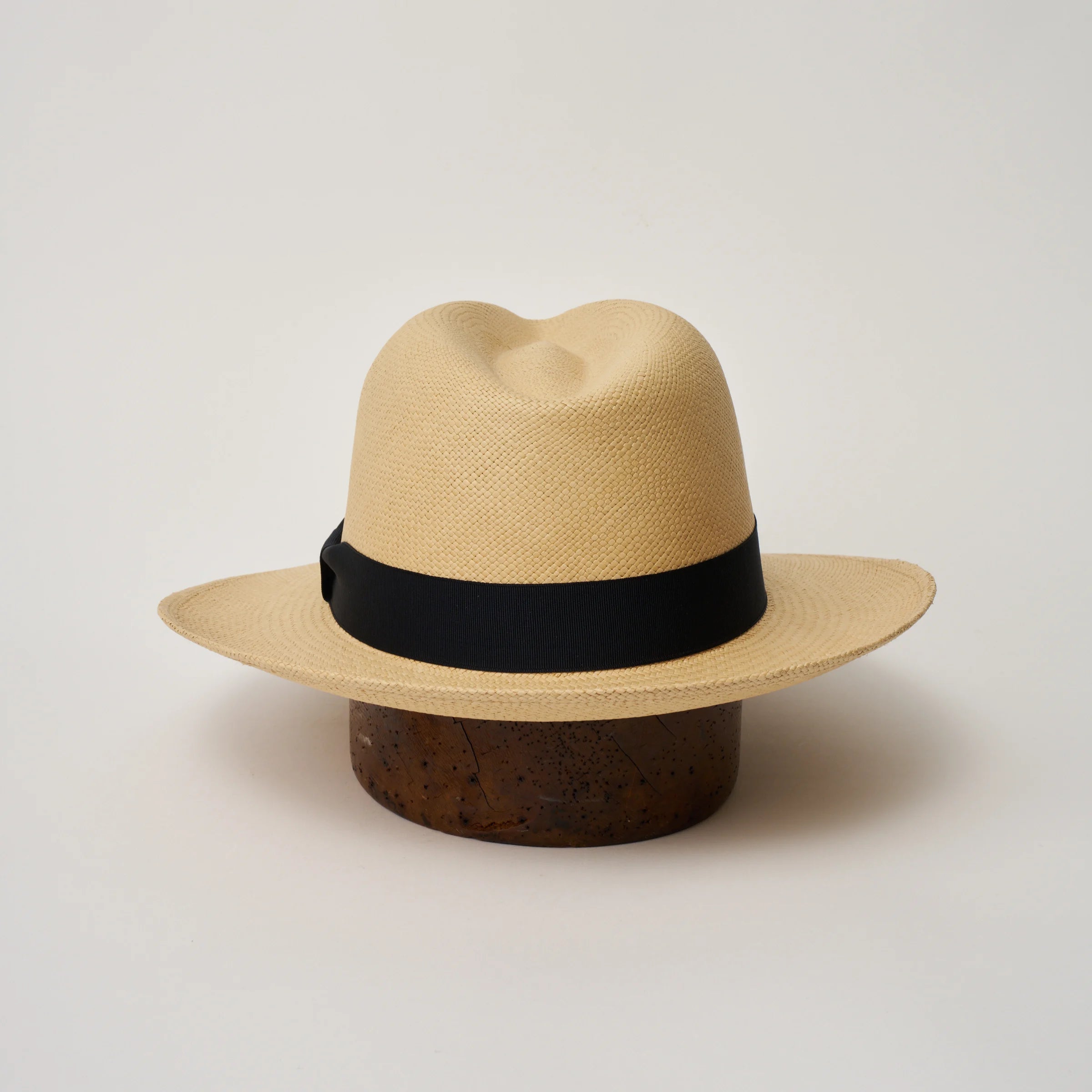 Studio image of the Camilo Classic Sand coloured Panama Hat with Marine trim taken from the back, showing the snapback brim.