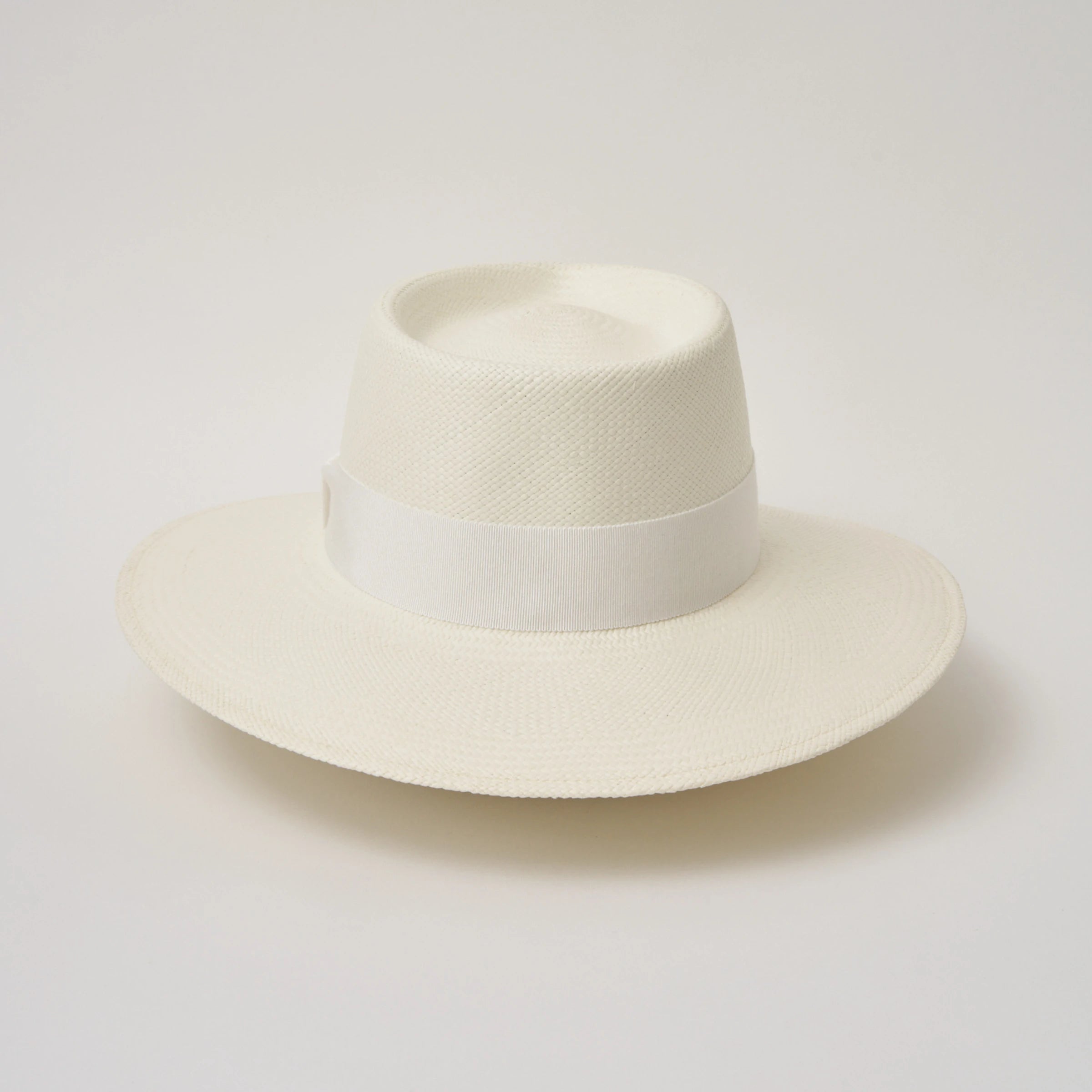 Studio image of the Camilo Country Cream coloured Panama Hat with White trim shown from the back.