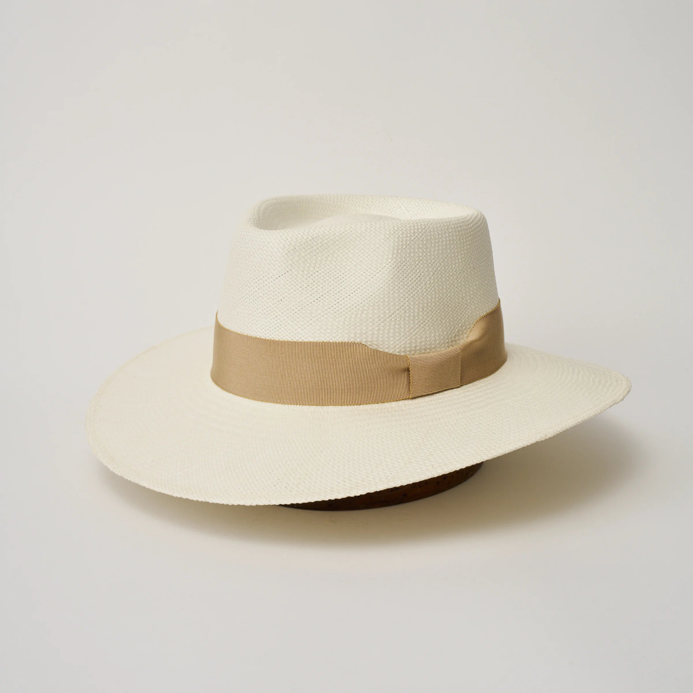 Studio image, angled view of the Camilo Country Cream coloured Panama Hat with Camel trim, showing the overall hat shape.