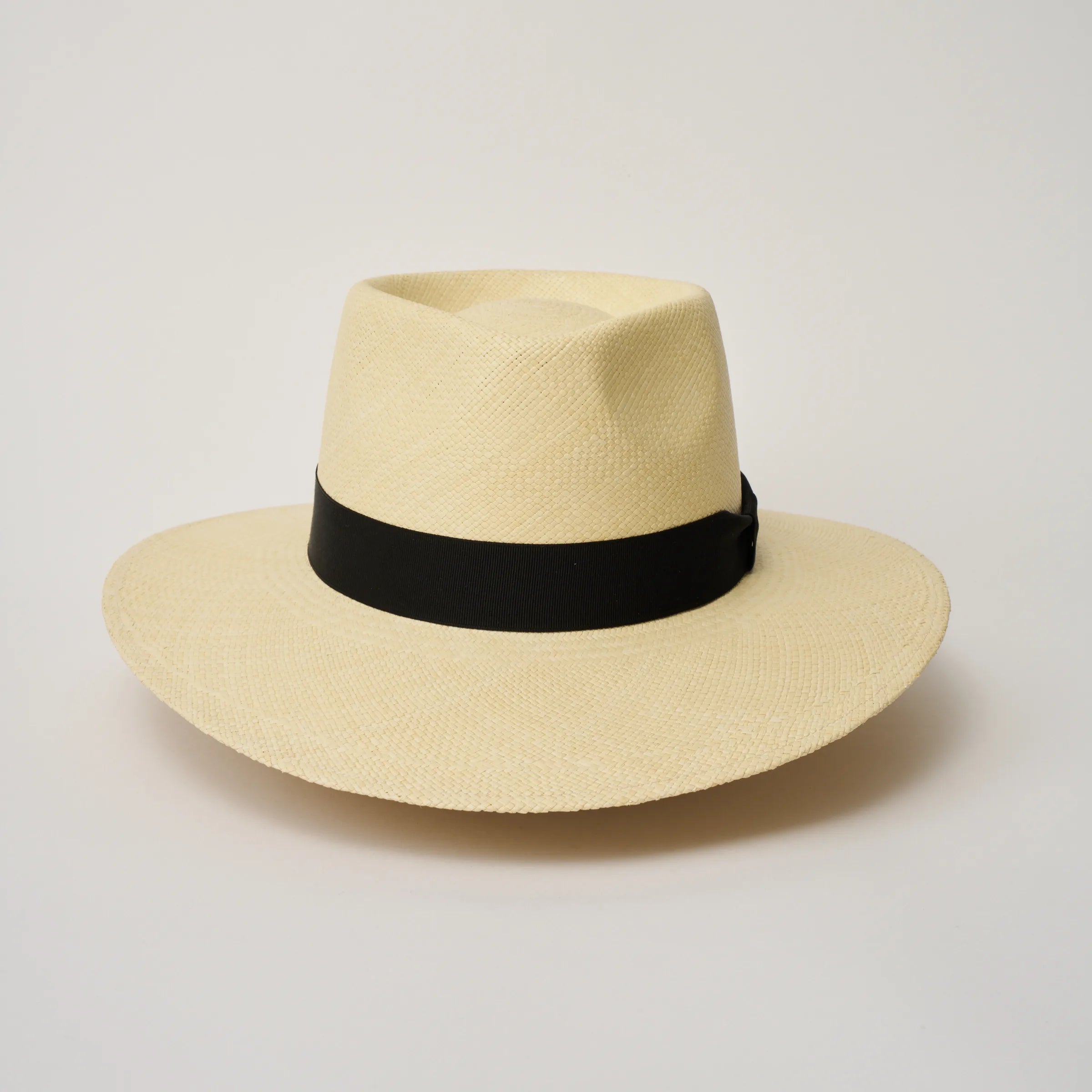 Studio image of the Camilo Country Natural coloured Panama Hat with Black trim taken from the front, showing pinch.