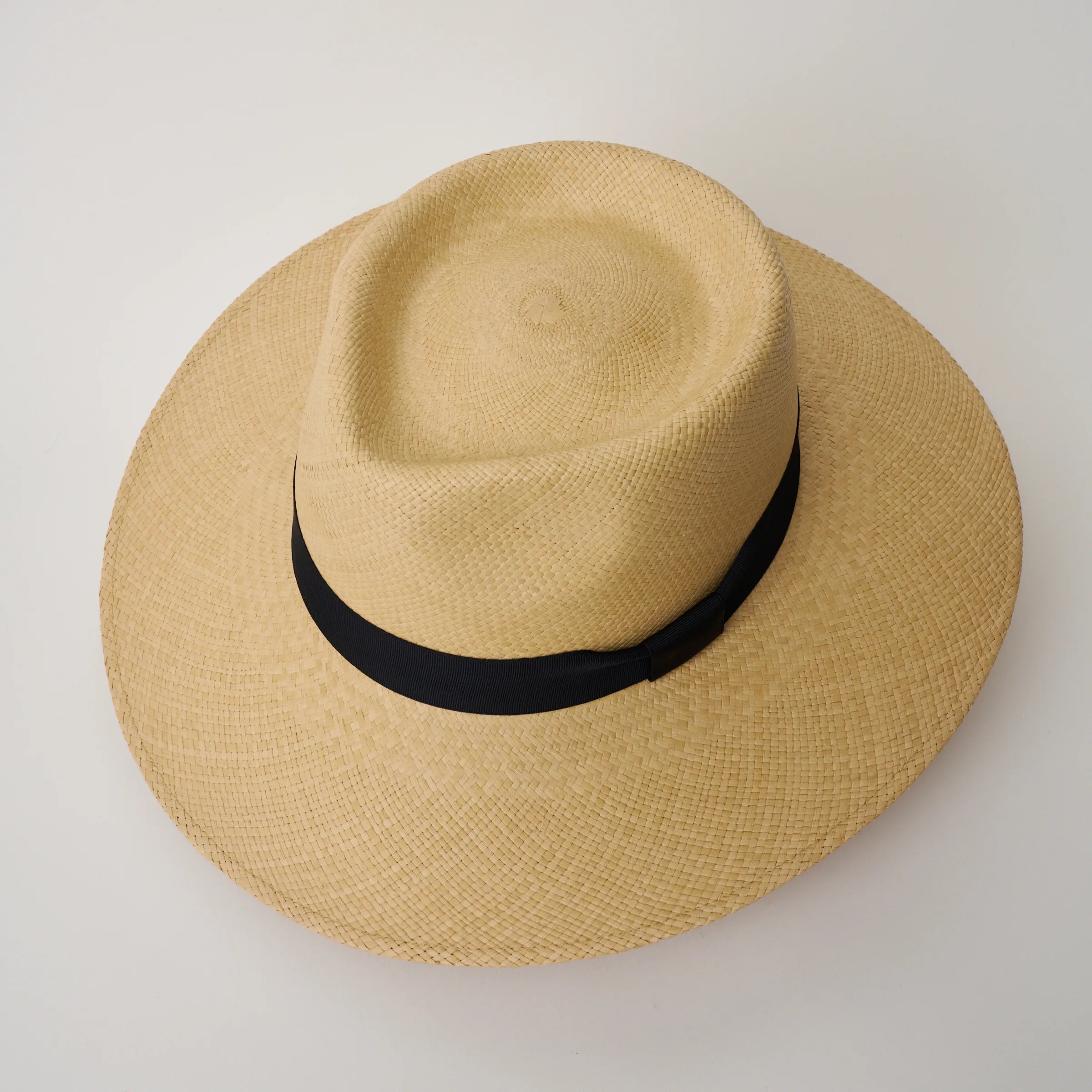 Studio image, looking top-down on the Camilo Country Sand coloured Panama Hat with Marine trim, showing the crown shape.