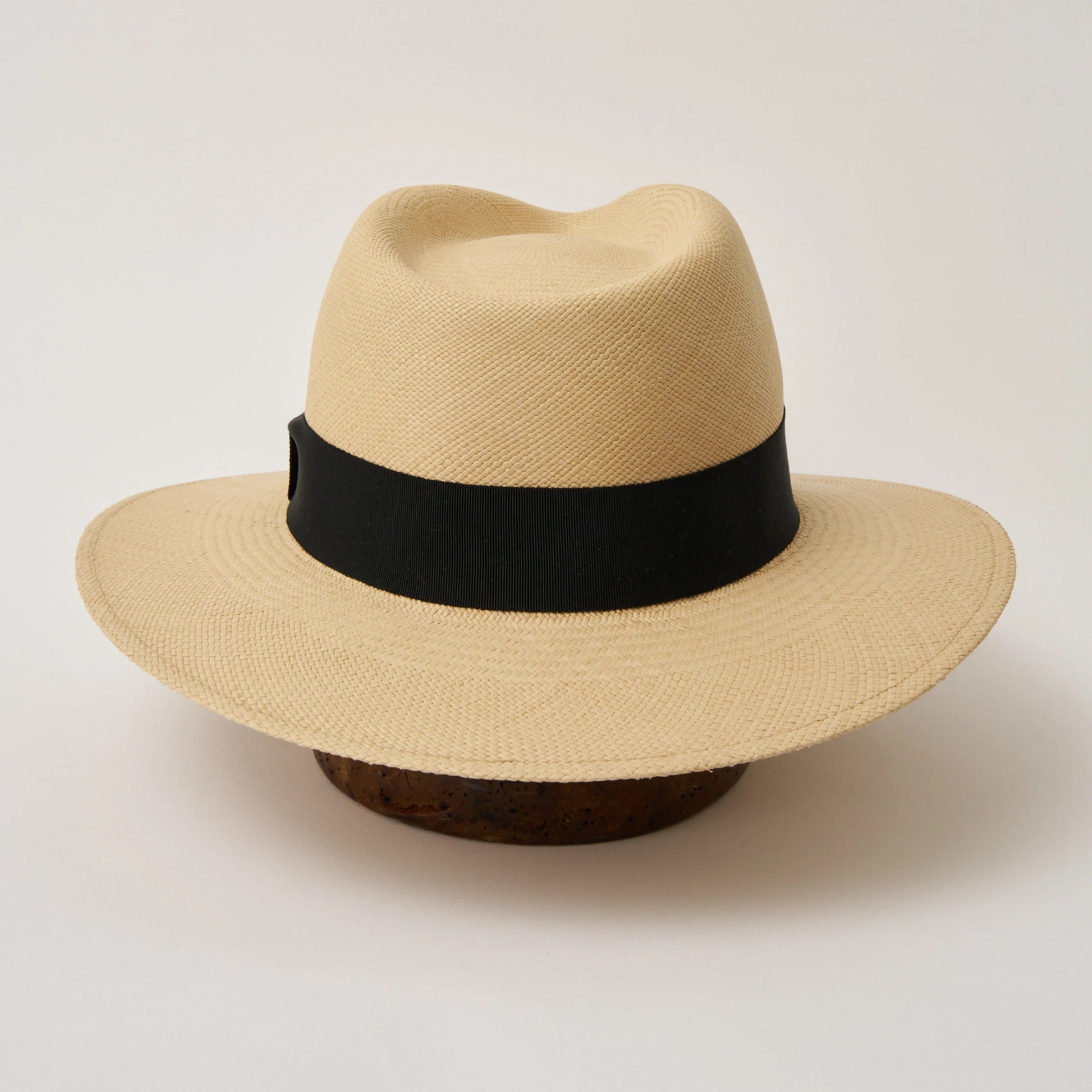 Studio image of the Camilo Executive Fino Sand coloured Panama Hat with Black trim taken from the back.