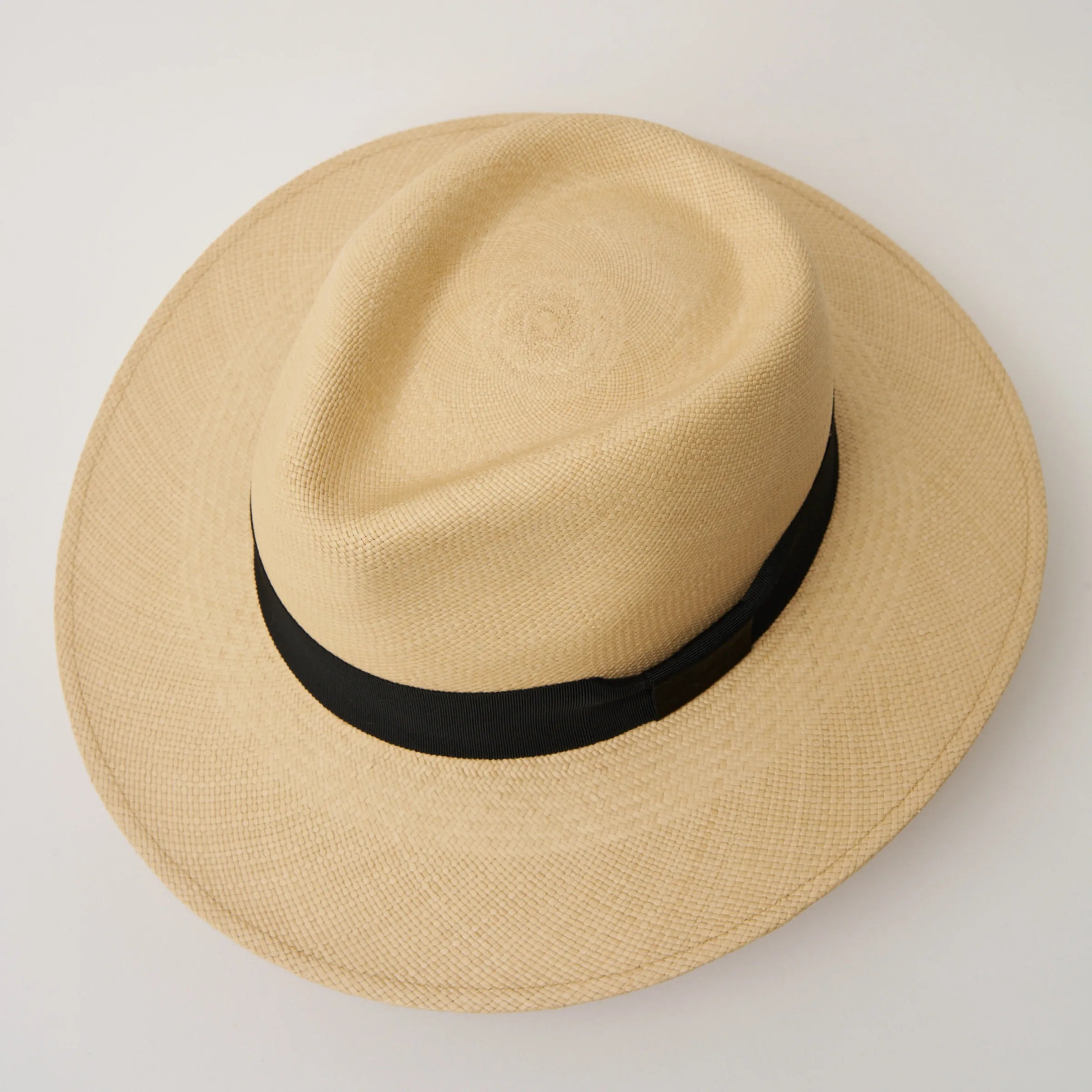 Studio image, looking top-down on the Camilo Executive Fino Sand coloured Panama Hat with Black trim, showing the crown shape.