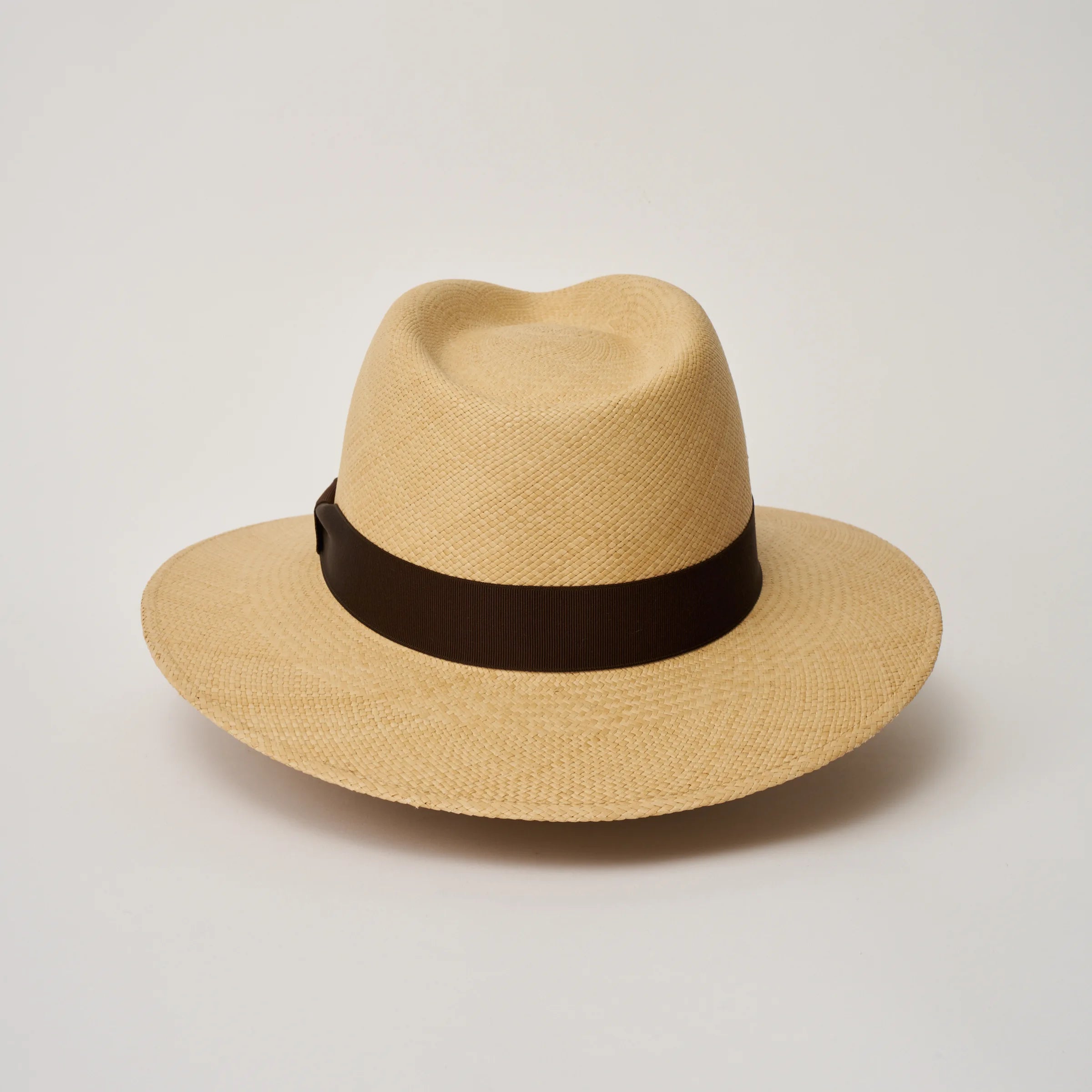 Studio image of the Camilo Executive Sand coloured Panama Hat with Caffe trim taken from the back.