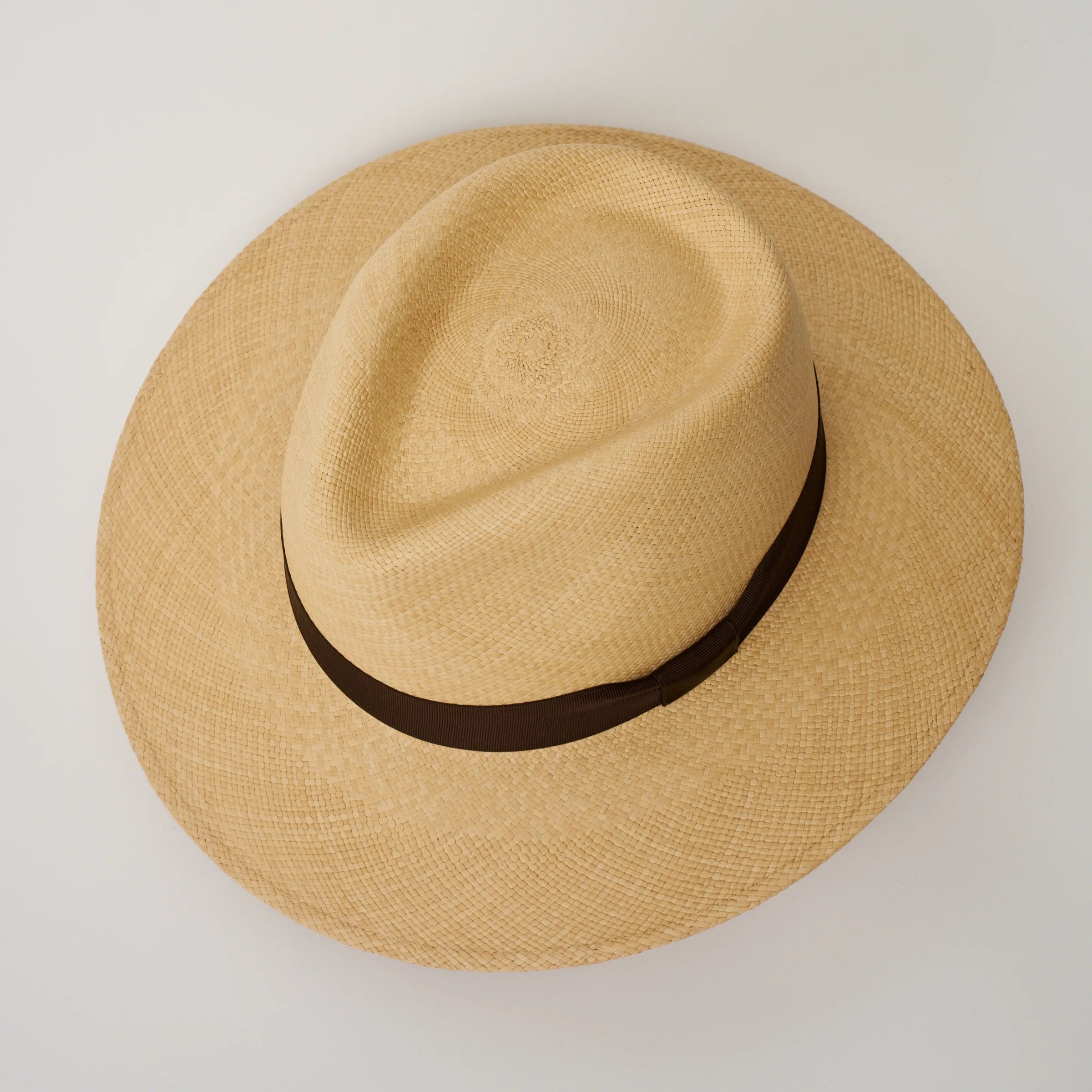 Studio image, looking top-down on the Camilo Executive Sand coloured Panama Hat with Caffe trim, showing the crown shape.