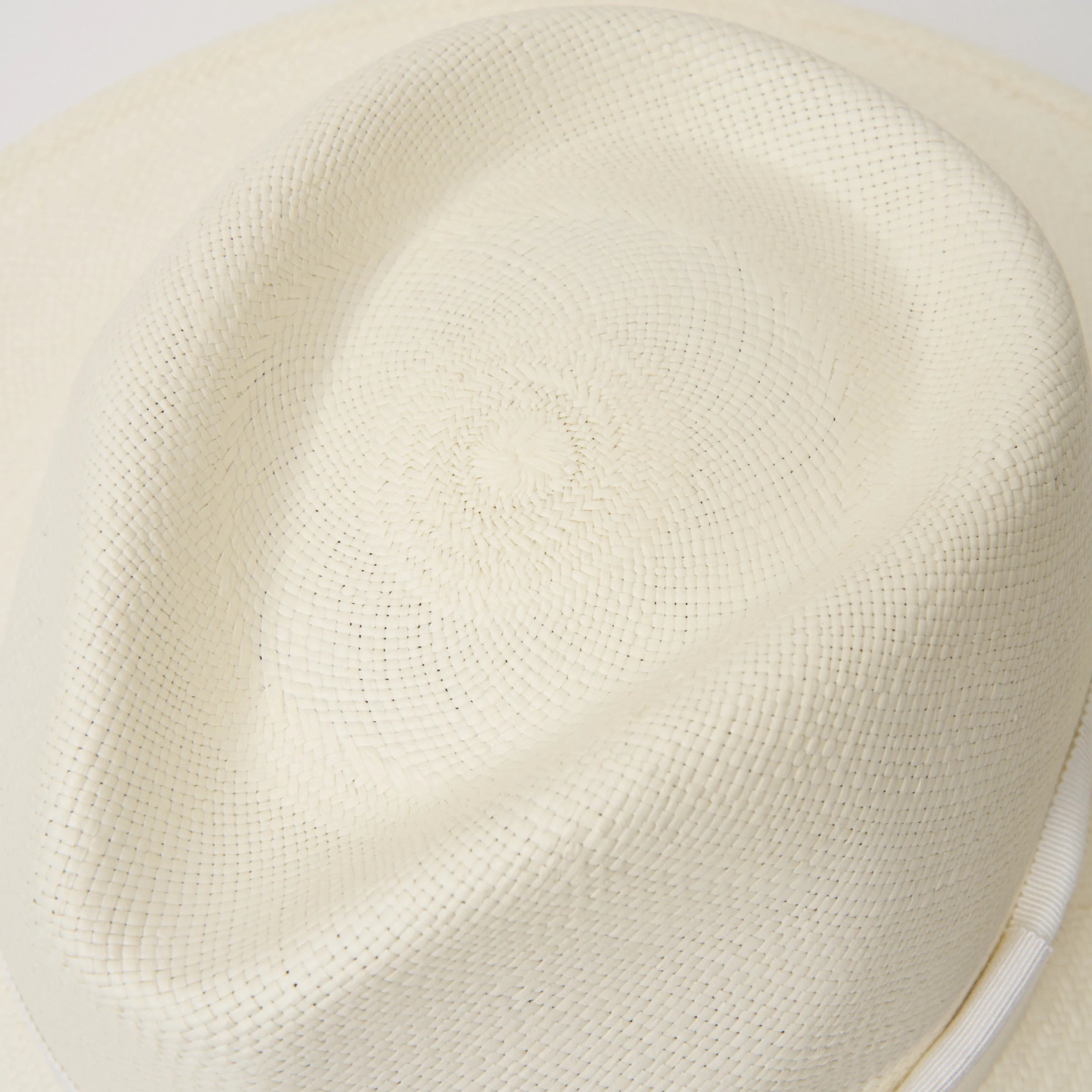 Studio closeup image of the top of the crown on the Cream coloured Camilo Oro Panama hat.