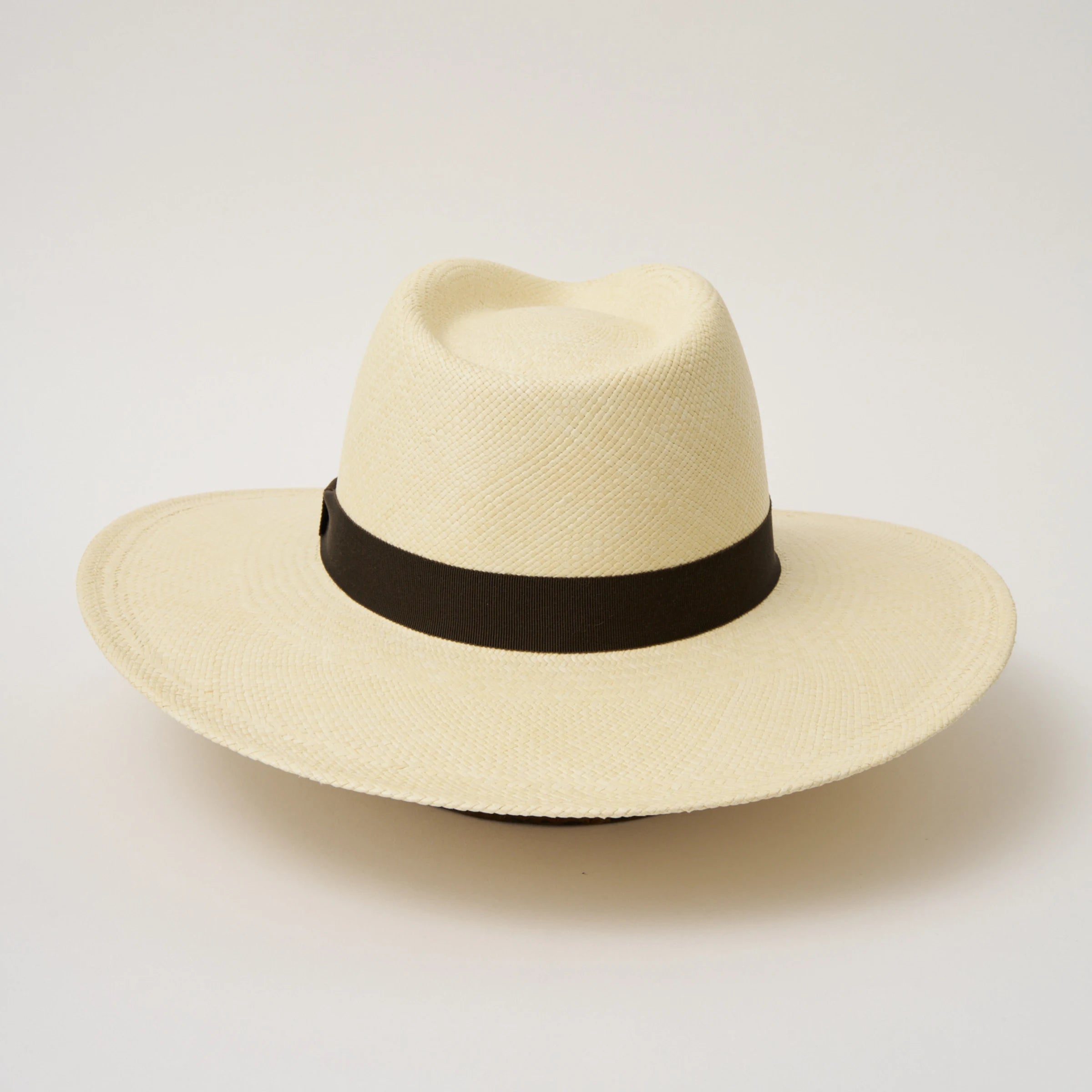 Studio image of the Camilo Oro Natural coloured Panama Hat with Espresso trim shown from the back.