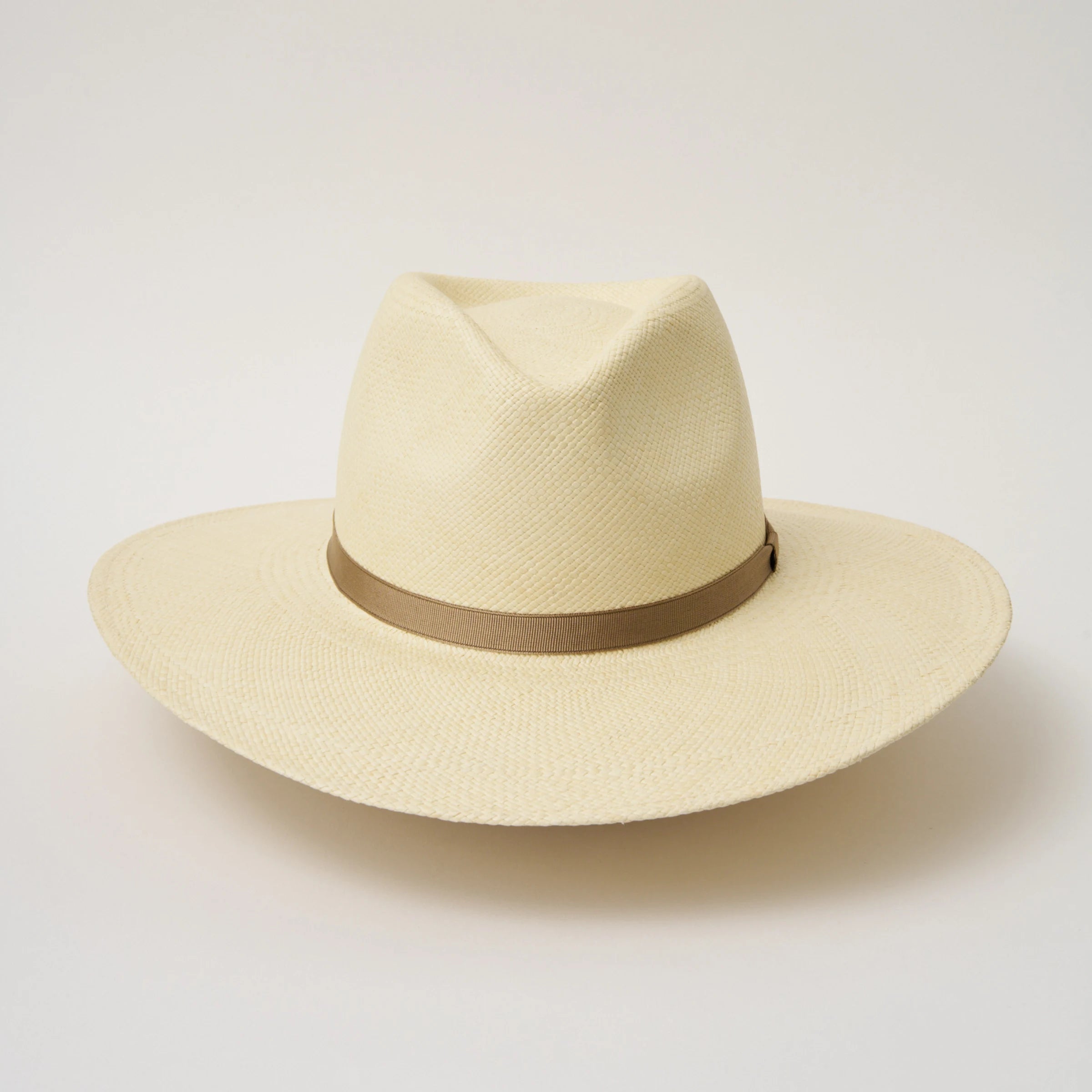 Studio image of the Camilo Oro Natural coloured Panama Hat with Taupe trim taken from the front showing pinch and brim.