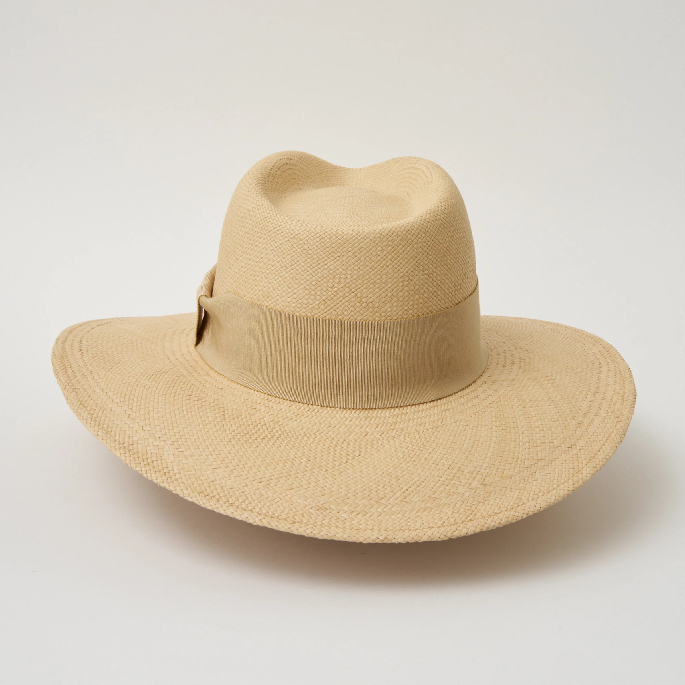Studio image of the Camilo Oro Sand coloured Panama Hat with Camel trim shown from the back.