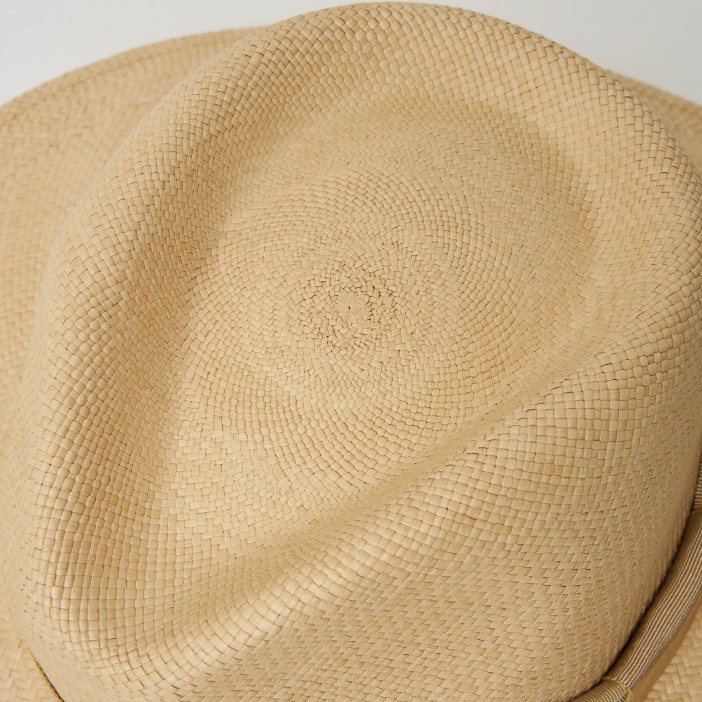 Studio closeup image of the top of the crown on the Sand/Camel coloured Camilo Oro Panama hat.