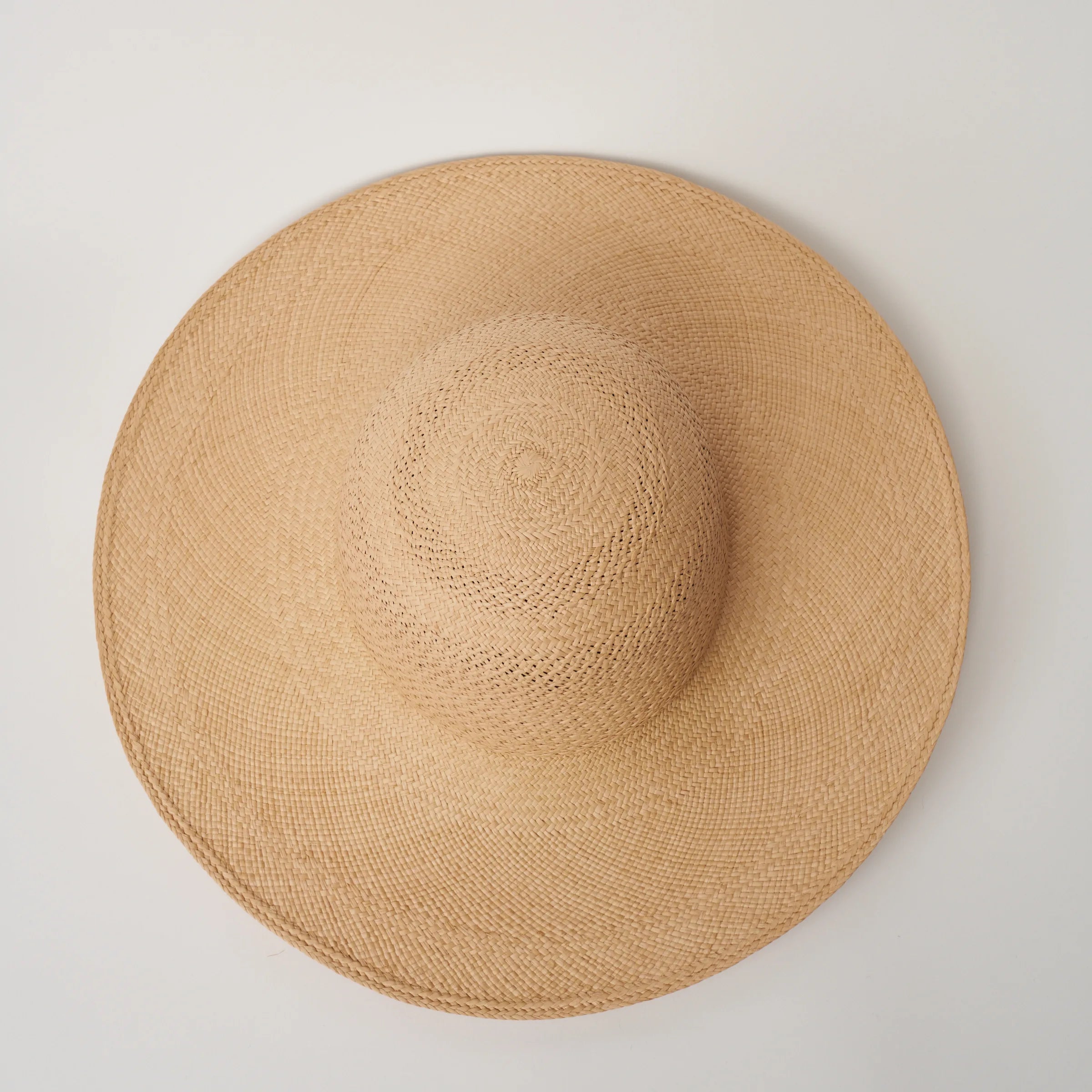 Studio image looking top down, of the Rio Sand coloured Panama Hat showing crochet crown detail.