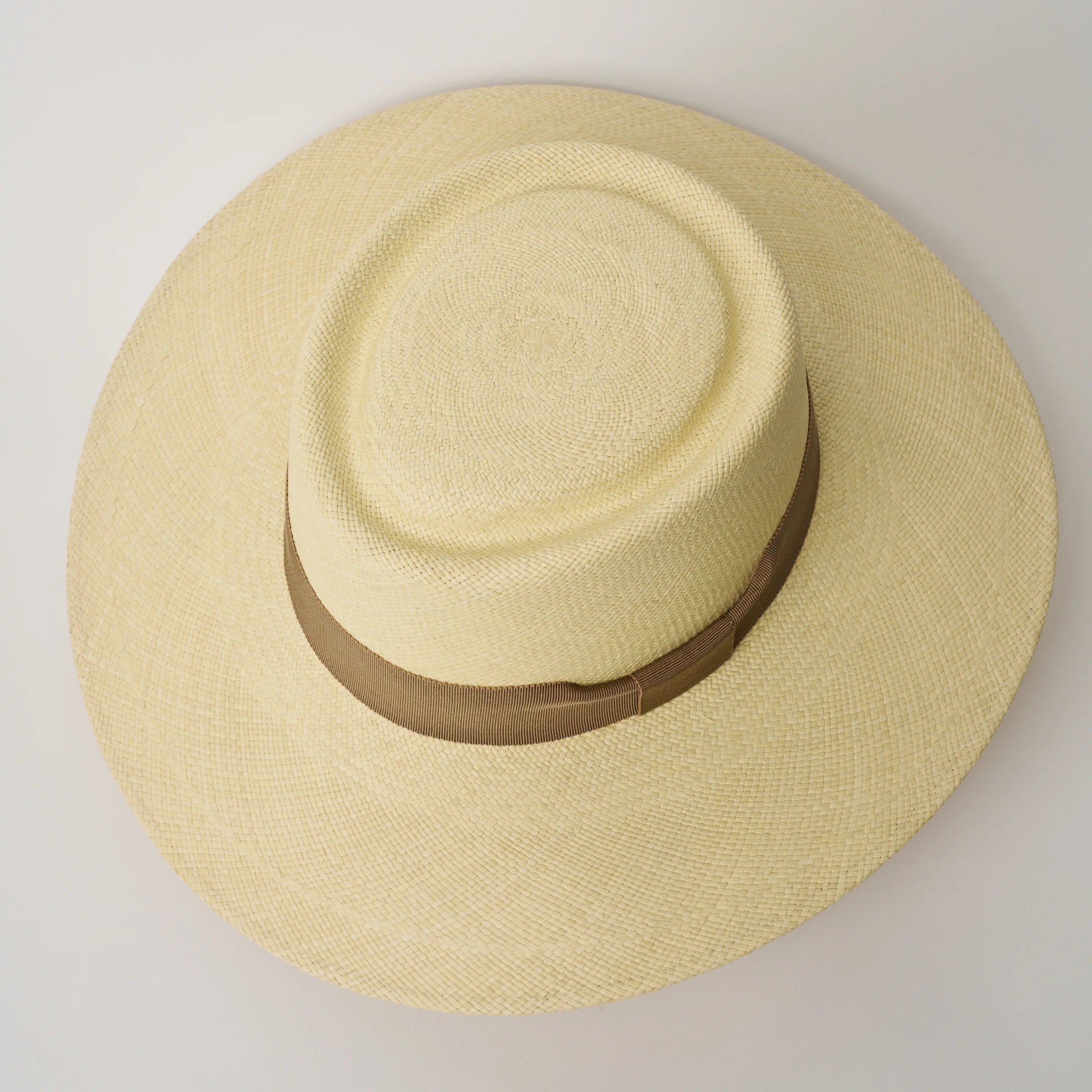 Studio image, looking top-down on the Camilo Sol Natural coloured Panama Hat with Oat trim, showing the crown shape.