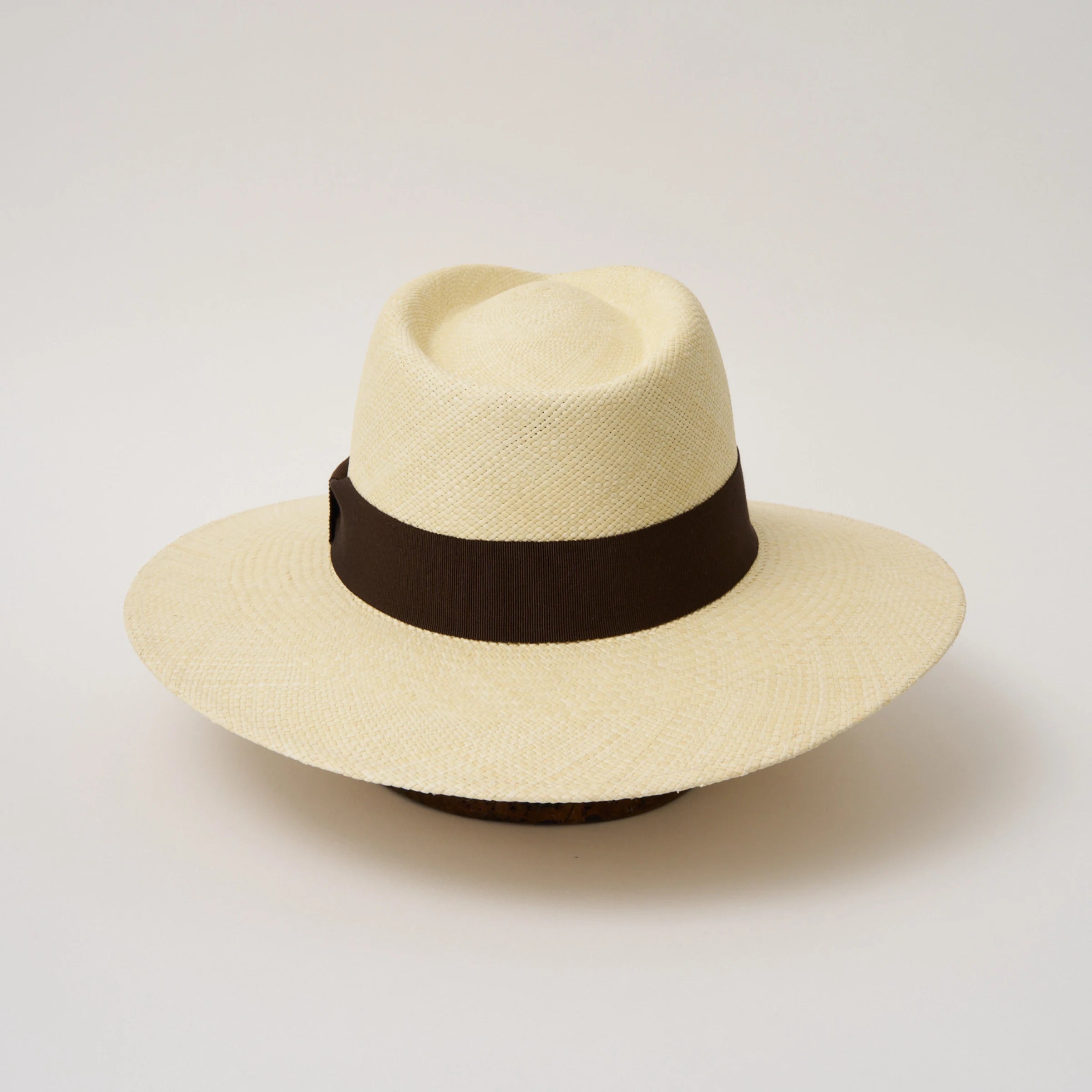 Studio image of the Camilo Vita Natural coloured Panama Hat with Chocolate trim shown from the back.