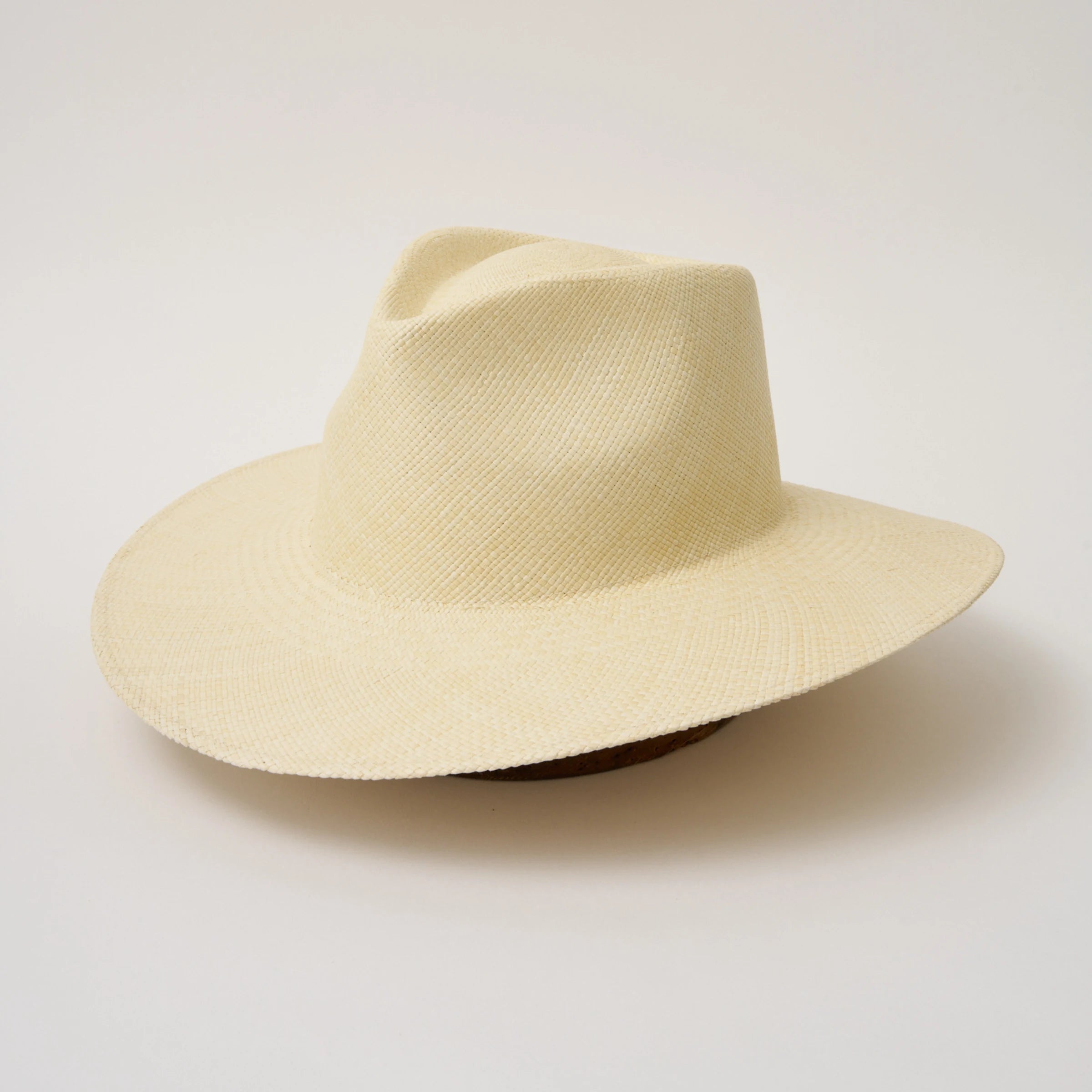 Studio image, angled view of the Camilo Vita Natural coloured Panama Hat, showing the overall hat shape.