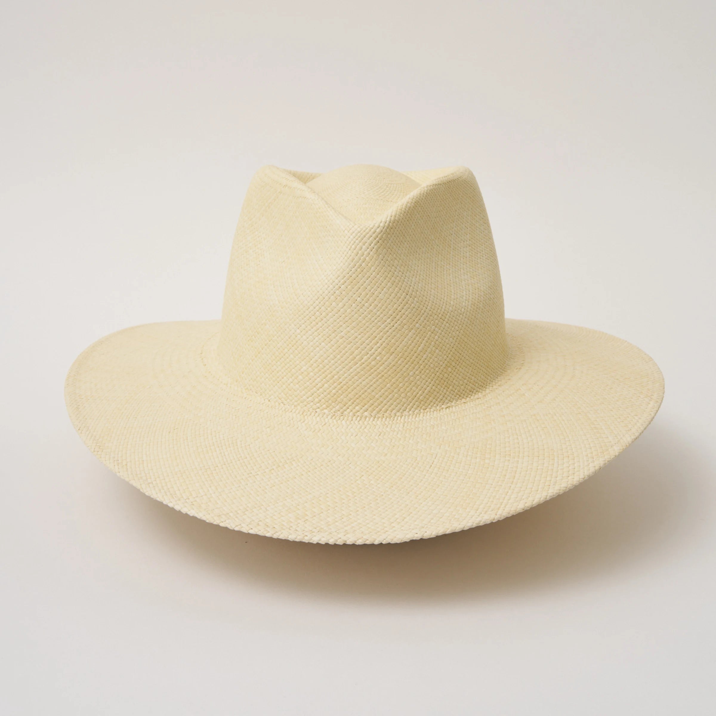 Studio image of the Camilo Vita Natural coloured Panama Hat taken from the front showing pinch and brim.