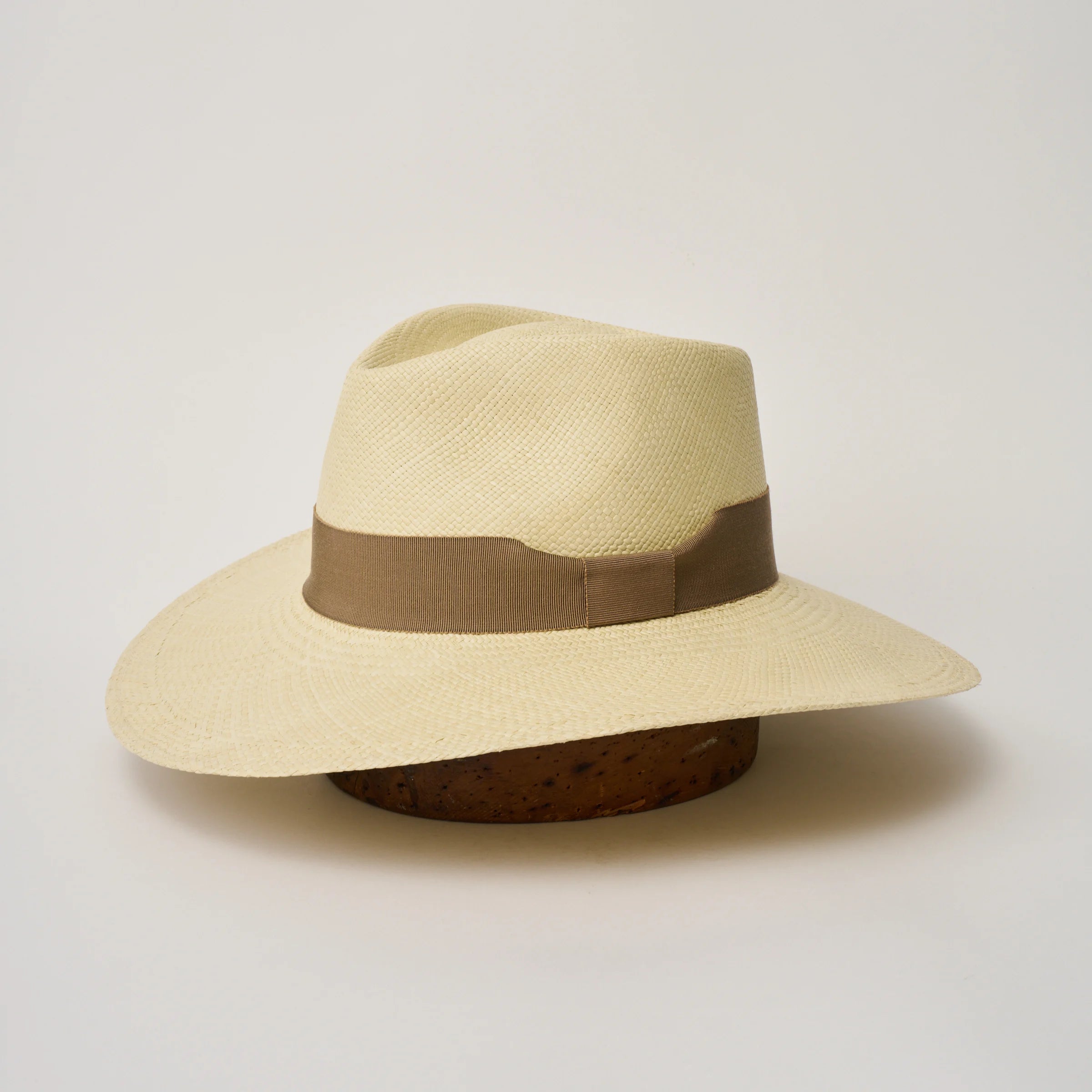 Studio image, angled view of the Camilo Vita Natural coloured Panama Hat with Oat trim, showing the overall hat shape.