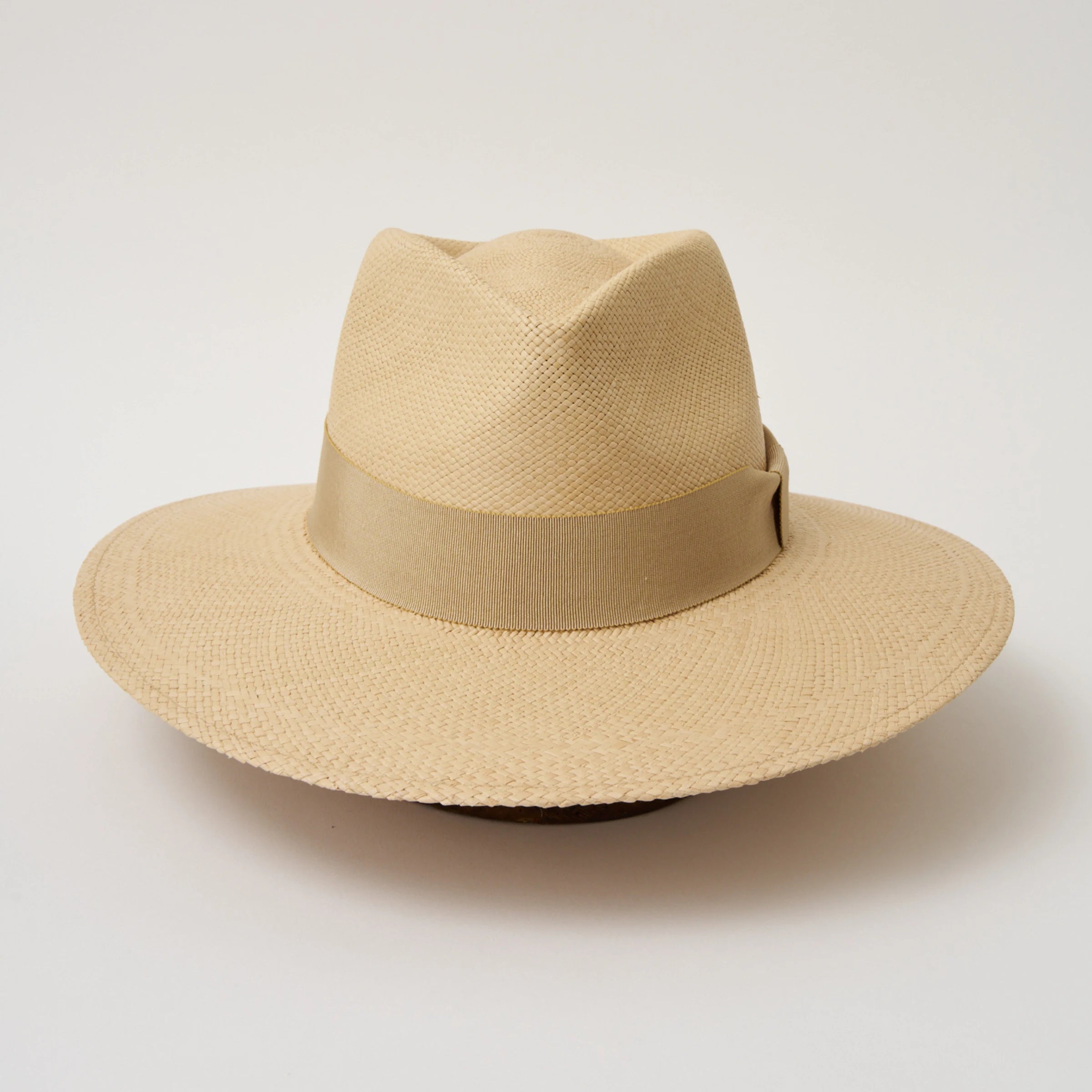 Studio image of the Camilo Vita Sandcoloured Panama Hat with Camel trim taken from the front showing pinch and brim.