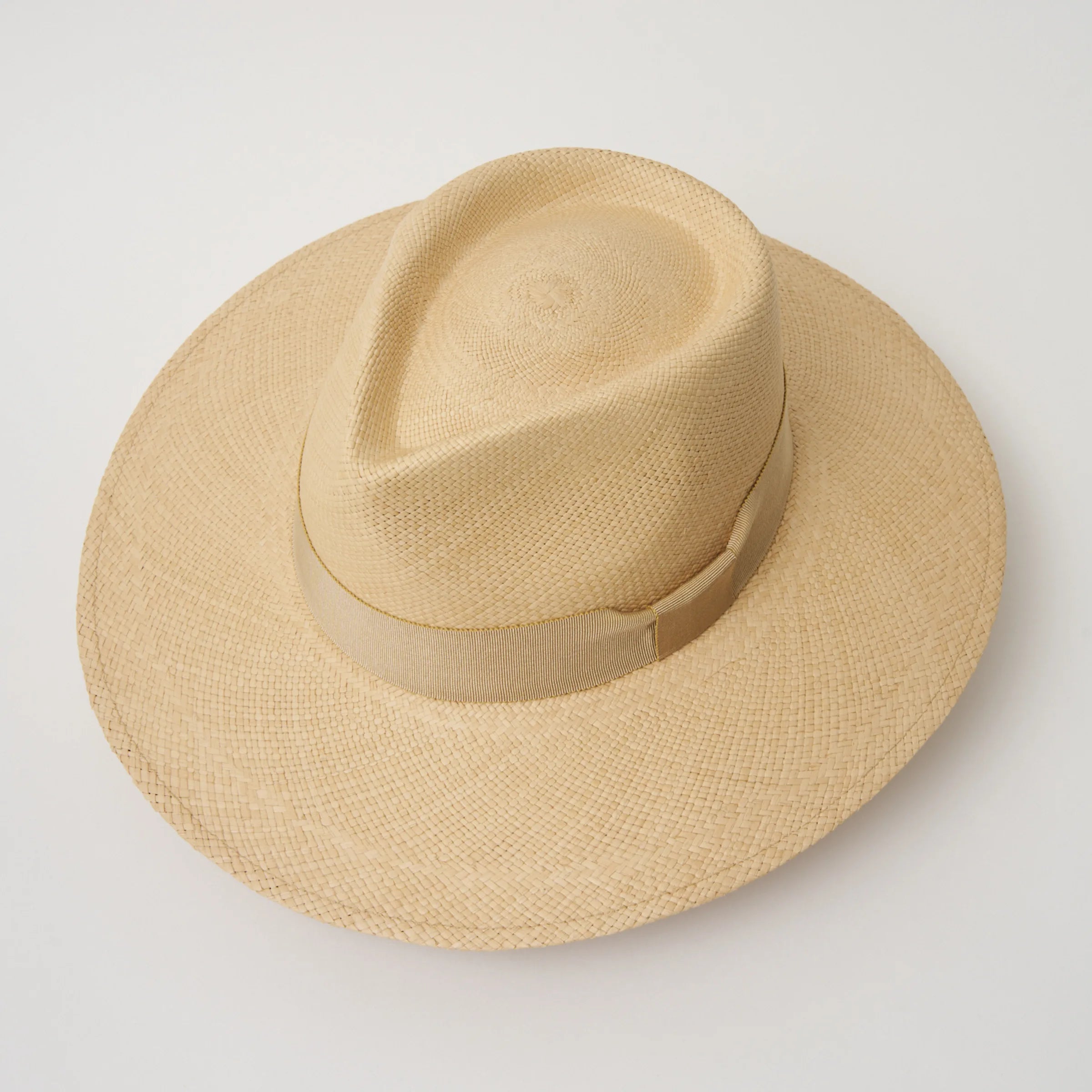 Studio image, taken looking down at the Camilo Vita Sand coloured Panama Hat with Camel trim, showing the crown shape and pinch.