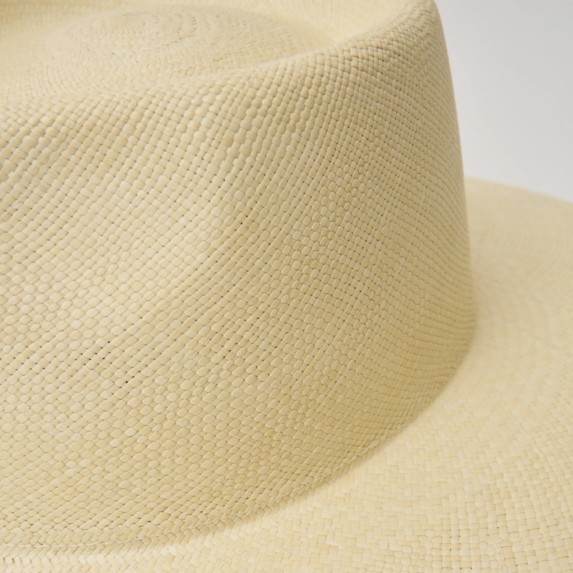 Close-up studio image of the Camilo Country Natural coloured Panama Hat, showing the hand-woven toquilla straw texture.