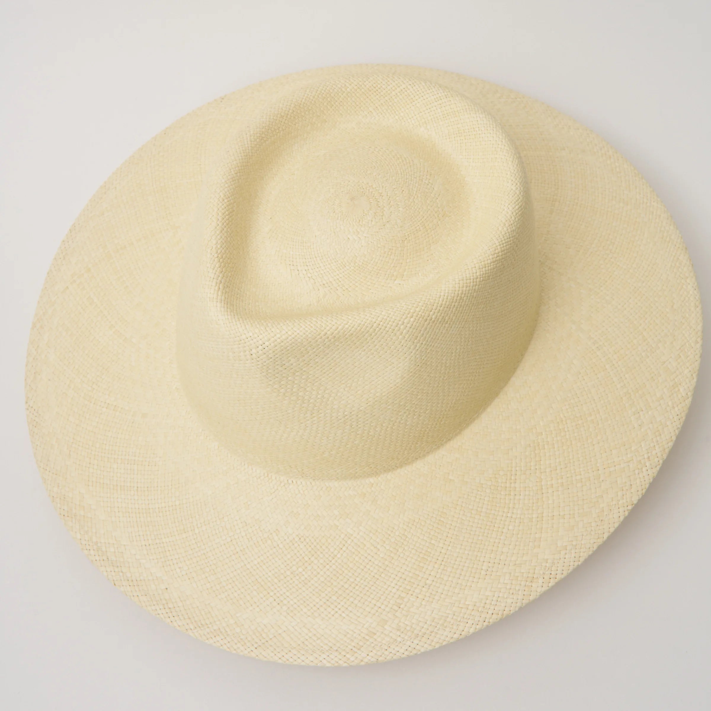 Studio image, taken looking down at the Camilo Country Natural coloured Panama Hat, showing the crown shape and pinch.