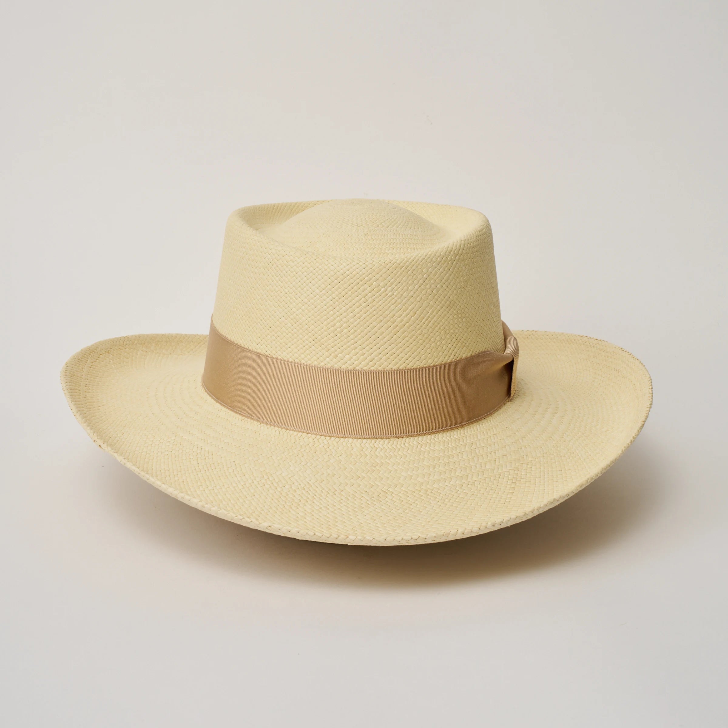 Studio image, looking top-down on the Camilo Gambler Natural coloured Panama Hat with Bone trim, showing the crown and brim shape.