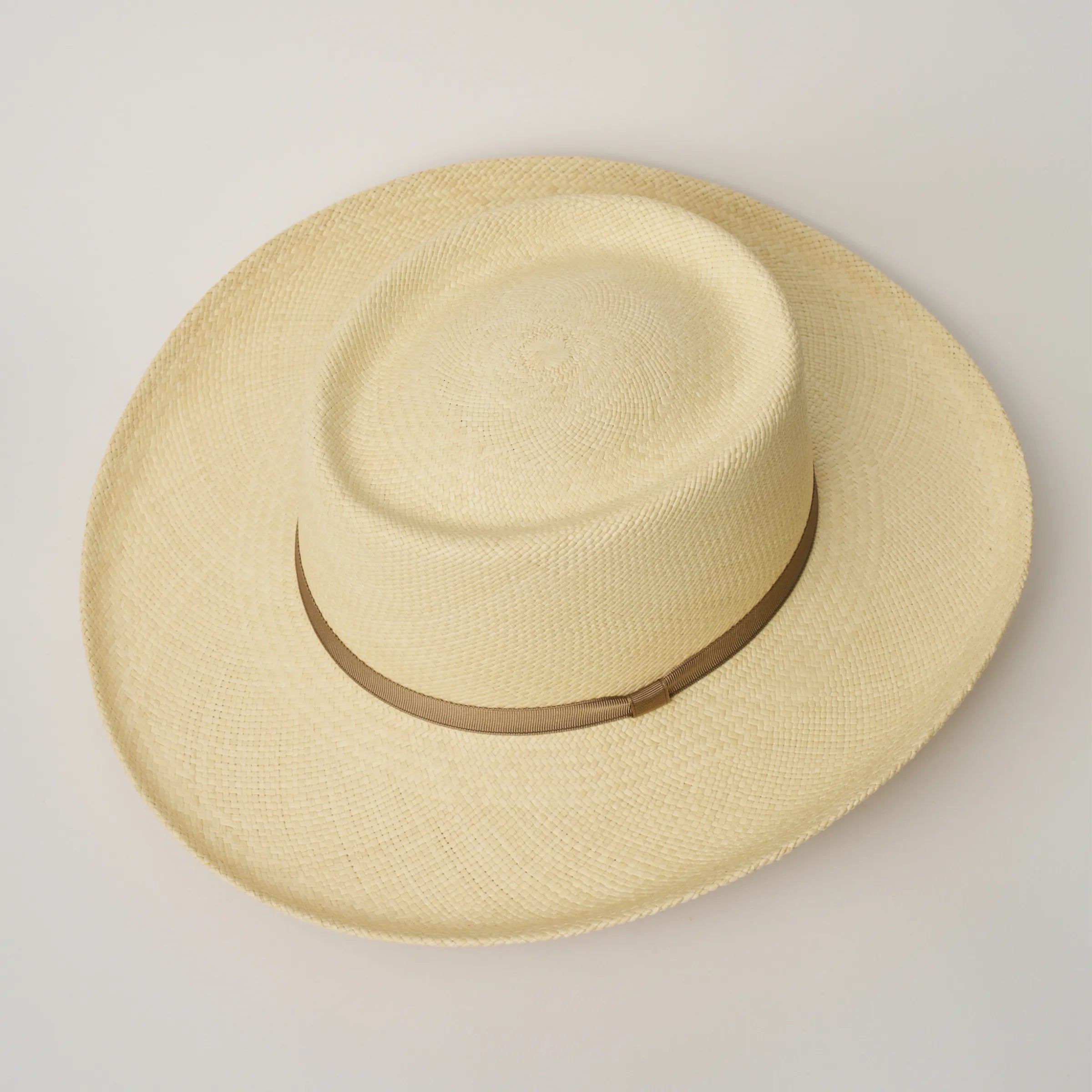 Studio image, looking top-down on the Camilo Gambler Natural coloured Panama Hat with Taupe trim, showing the crown shape.