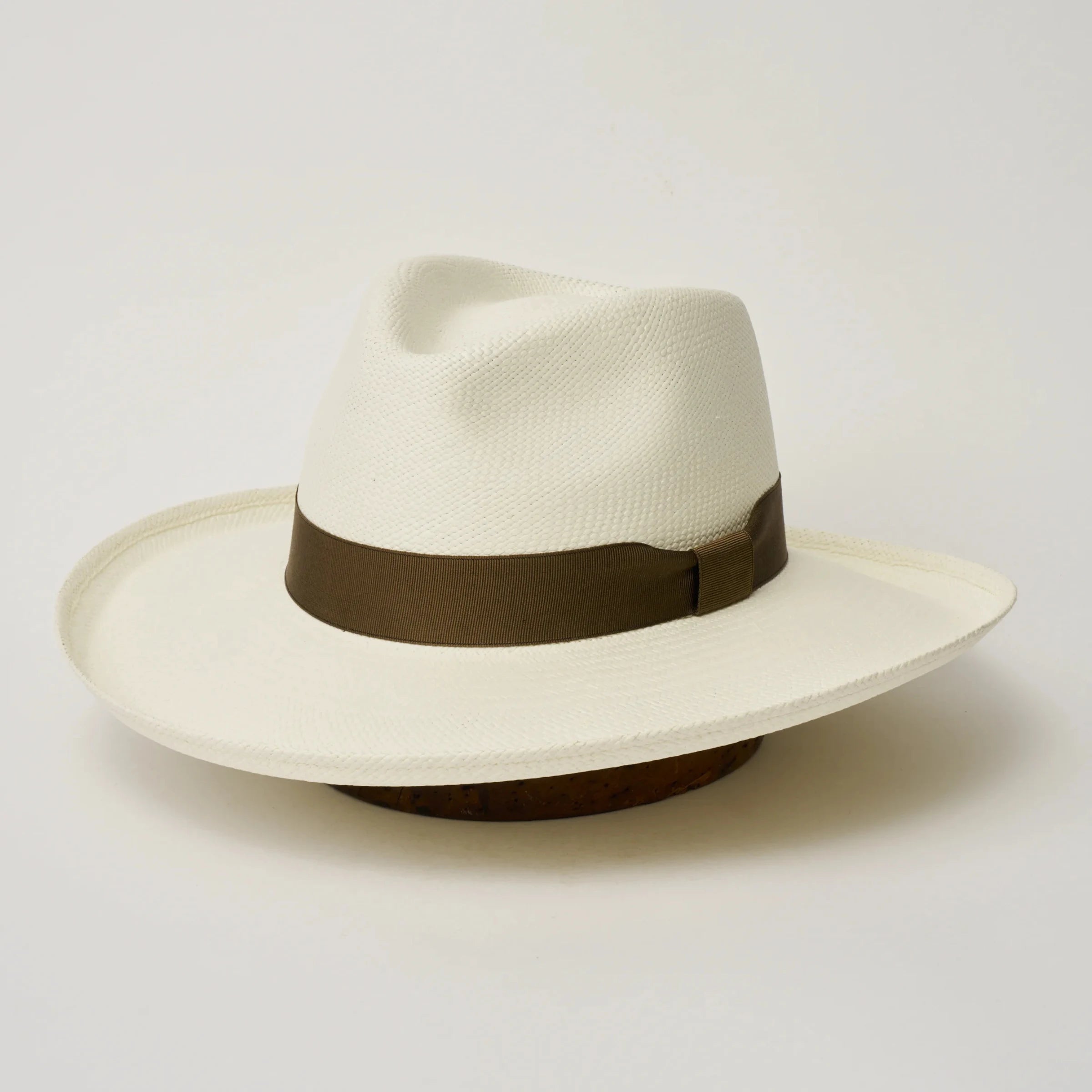 Studio image of the Camilo Grand Planter Cream coloured Panama Hat with Fawn trim, angled showing the crown shape, front crease and ribbon details.
