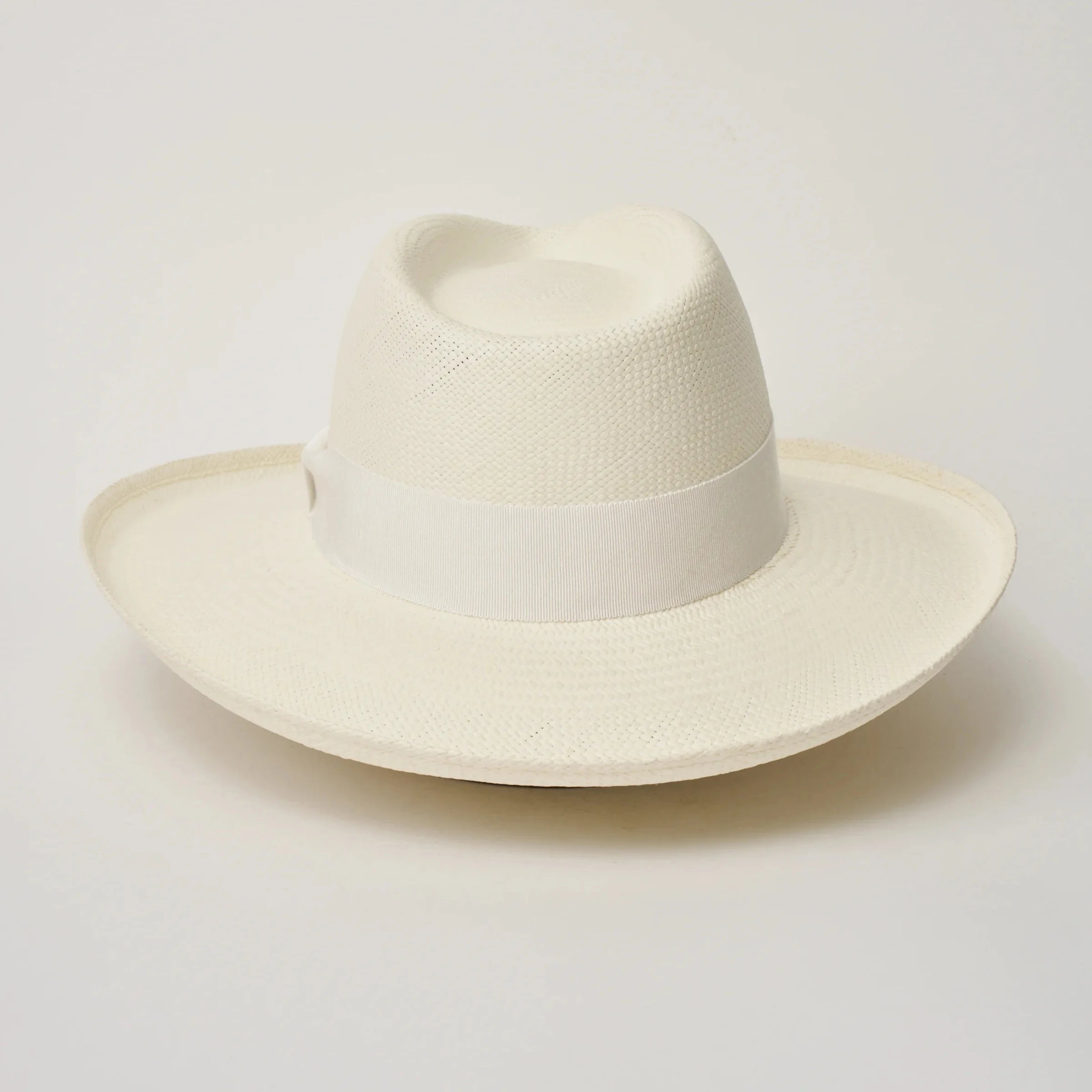 Studio image of the Camilo Grand Planter Cream coloured Panama Hat with White trim taken from the back.