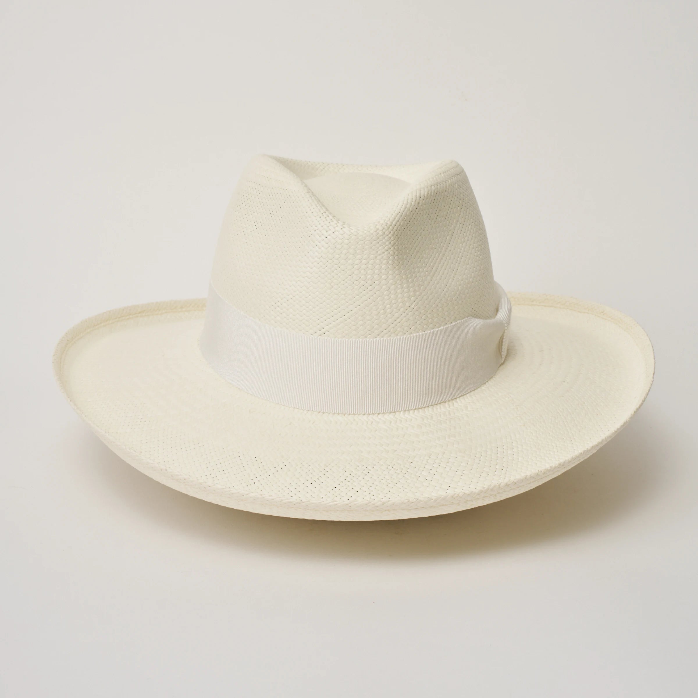 Studio image, looking top-down on the Camilo Grand Planter Cream coloured Panama Hat with White trim, showing the crown and brim shape.