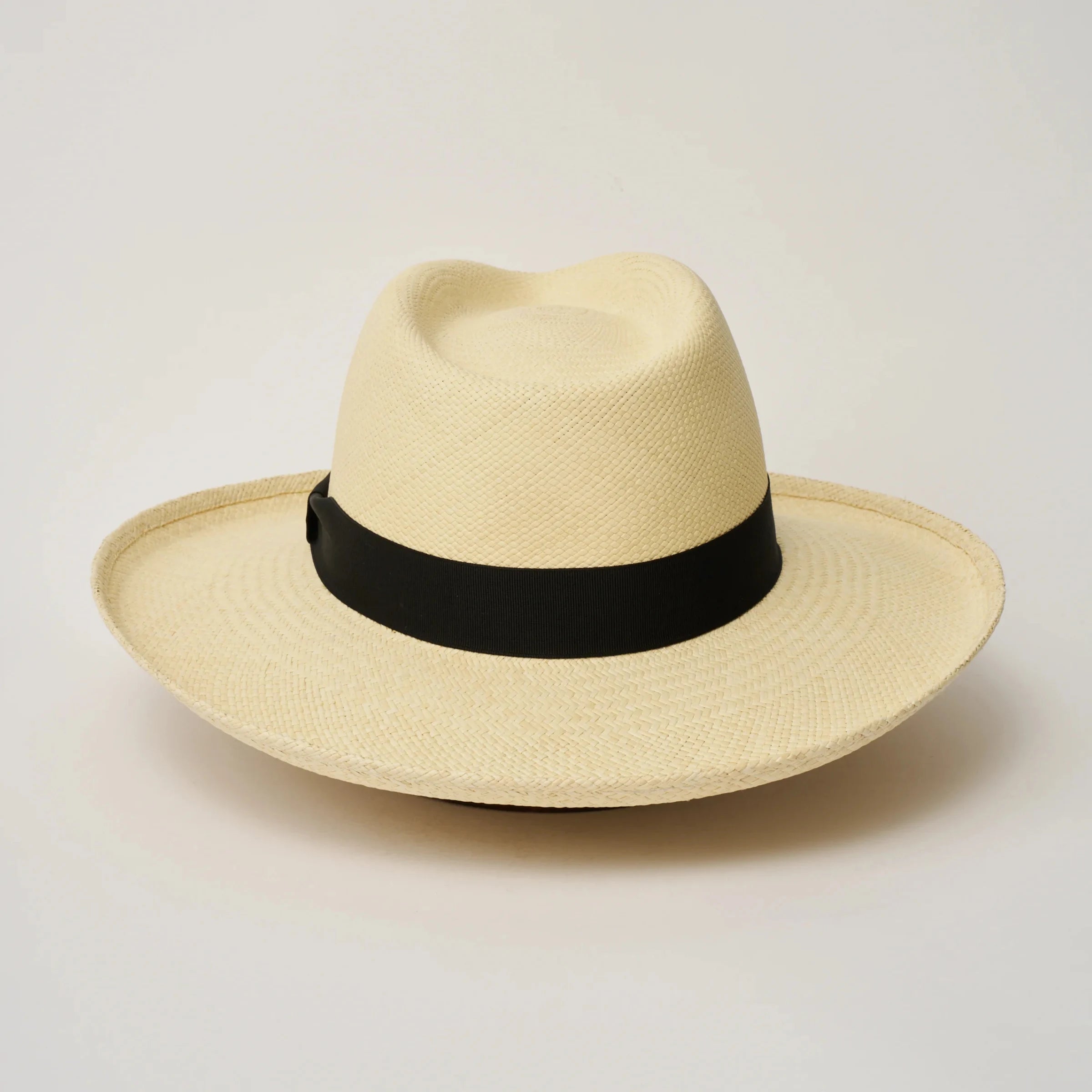 Studio image of the Camilo Grand Planter Natural coloured Panama Hat with Black trim taken from the back.