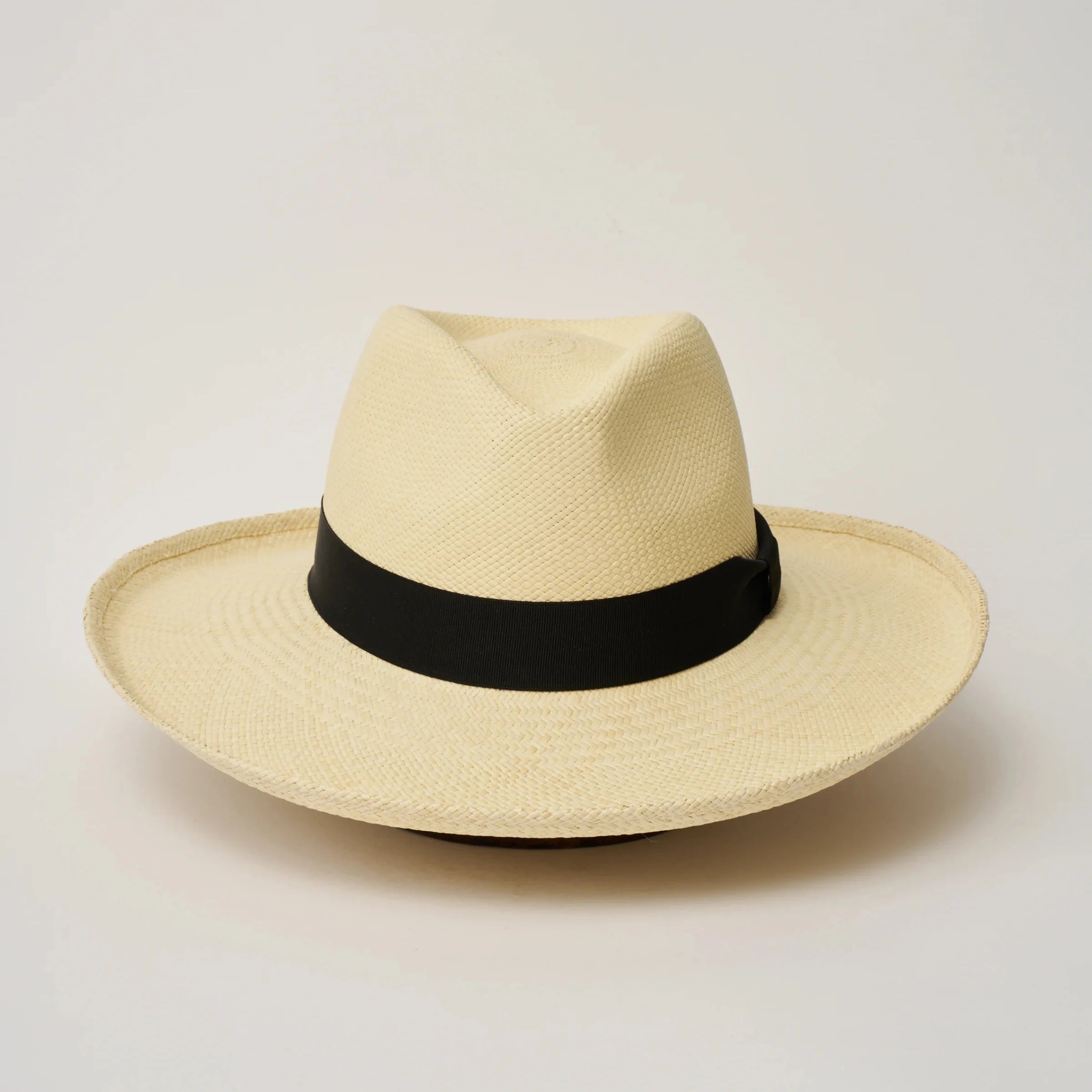 Studio image, looking top-down on the Camilo Grand Planter Natural coloured Panama Hat with Black trim, showing the crown and brim shape.