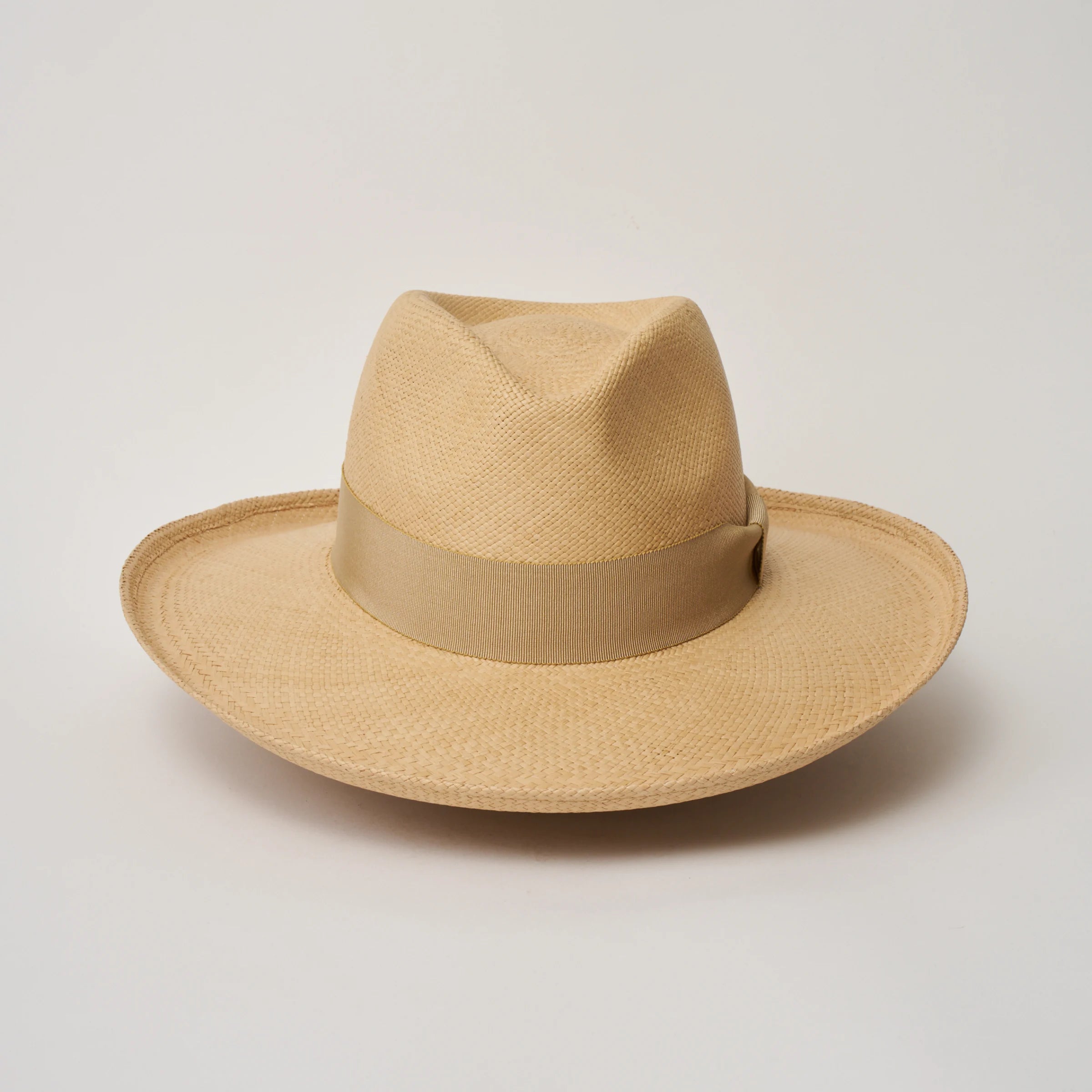 Studio image, looking top-down on the Camilo Grand Planter Sand coloured Panama Hat with Camel trim, showing the crown and brim shape.