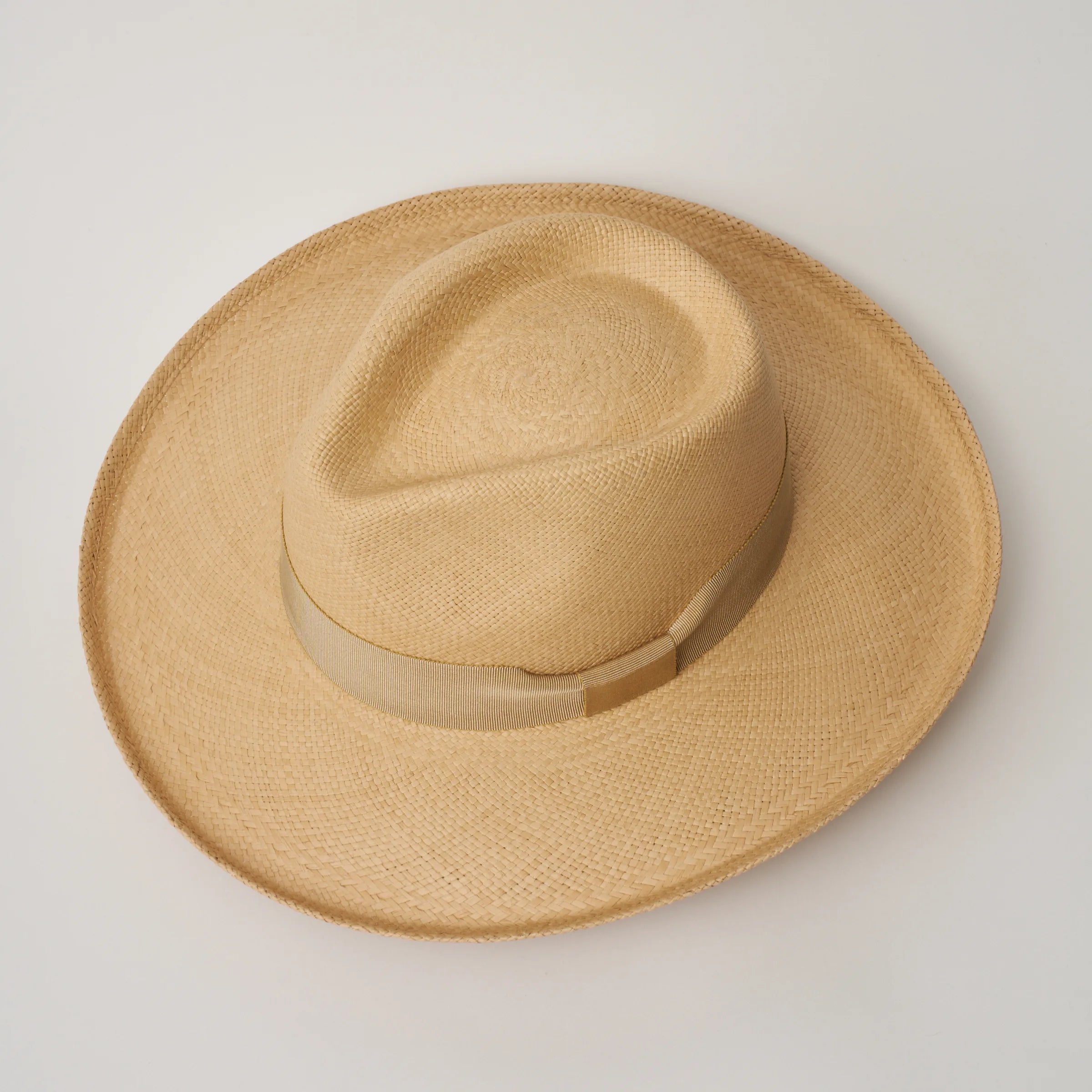 Studio image, looking top-down on the Camilo Grand Planter Sand coloured Panama Hat with Camel trim, showing the crown shape.