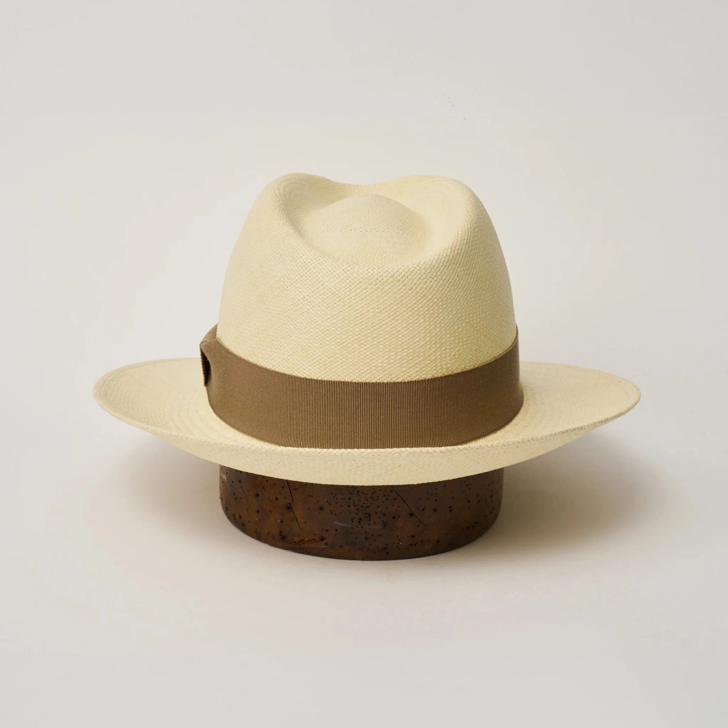 Studio image of the Camilo New Fedora Fino Natural coloured Panama Hat with Oat trim shown from the back, showing snapback brim.