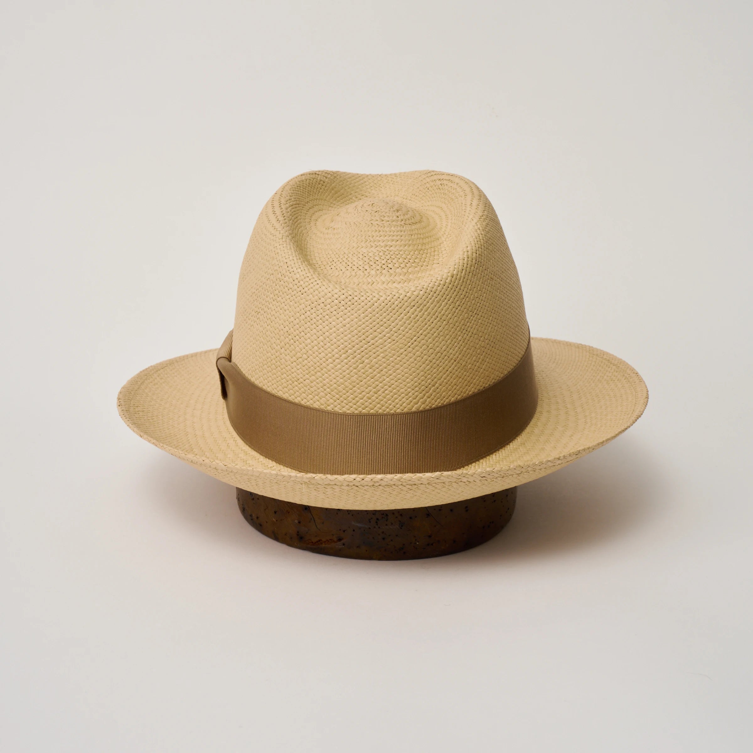 Studio image of the Camilo New Fedora Sand coloured Panama Hat with Tan trim shown from the back, showing snapback brim.