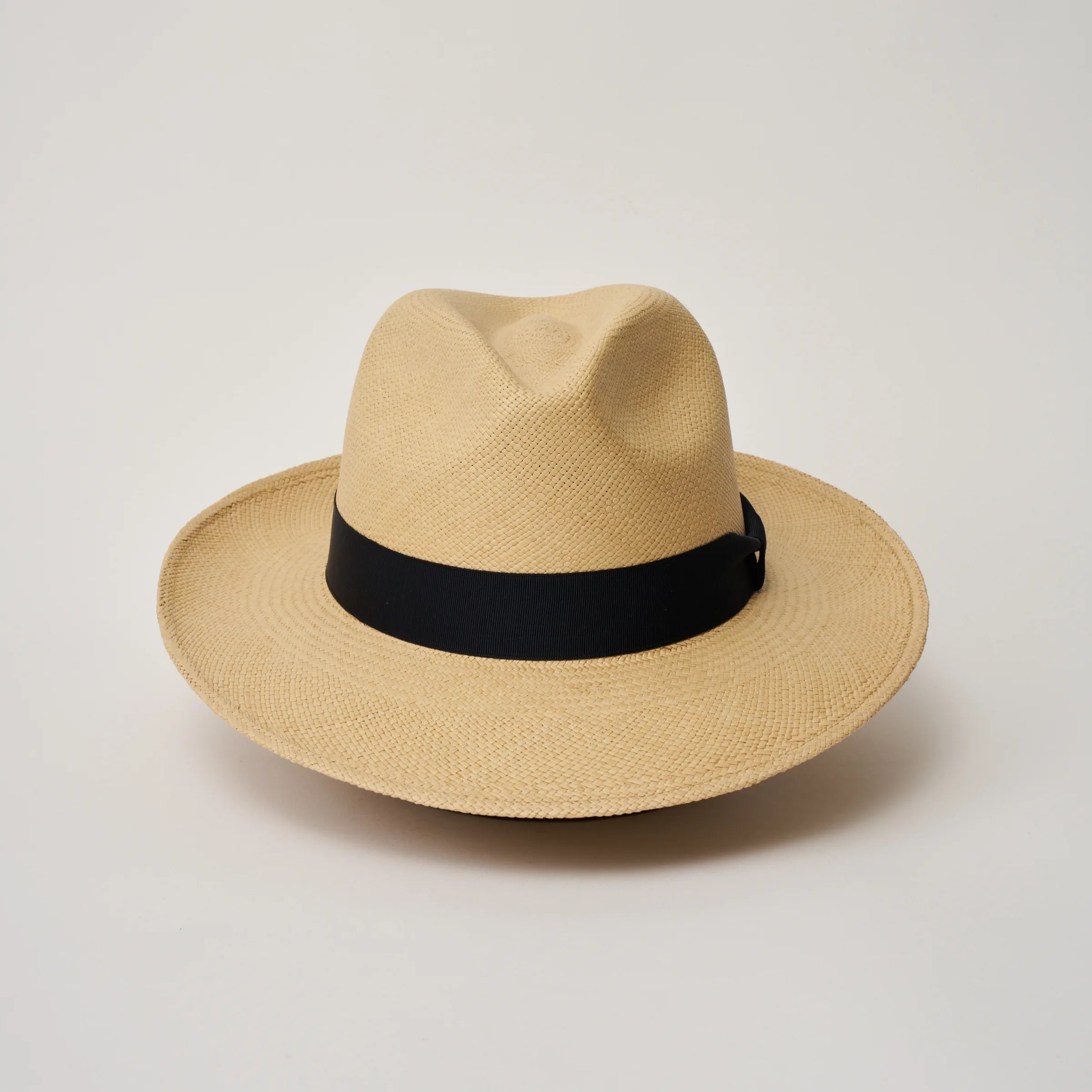 Studio image of the Camilo Classic Sand coloured Panama Hat with Marine trim shown from the front showing crown pinch.