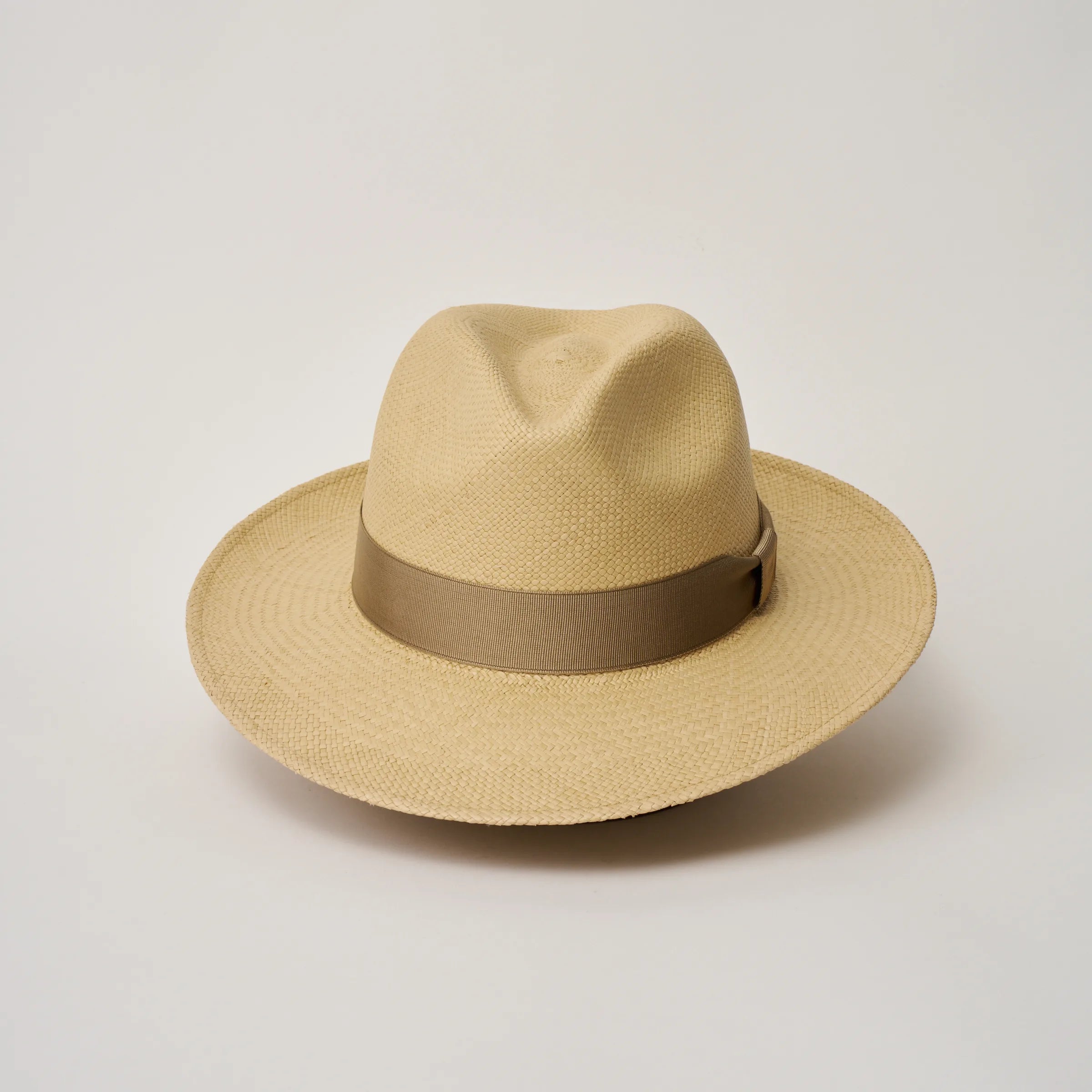 Studio image of the Camilo Classic Sand coloured Panama Hat with Taupe trim taken from the front showing pinch and brim.