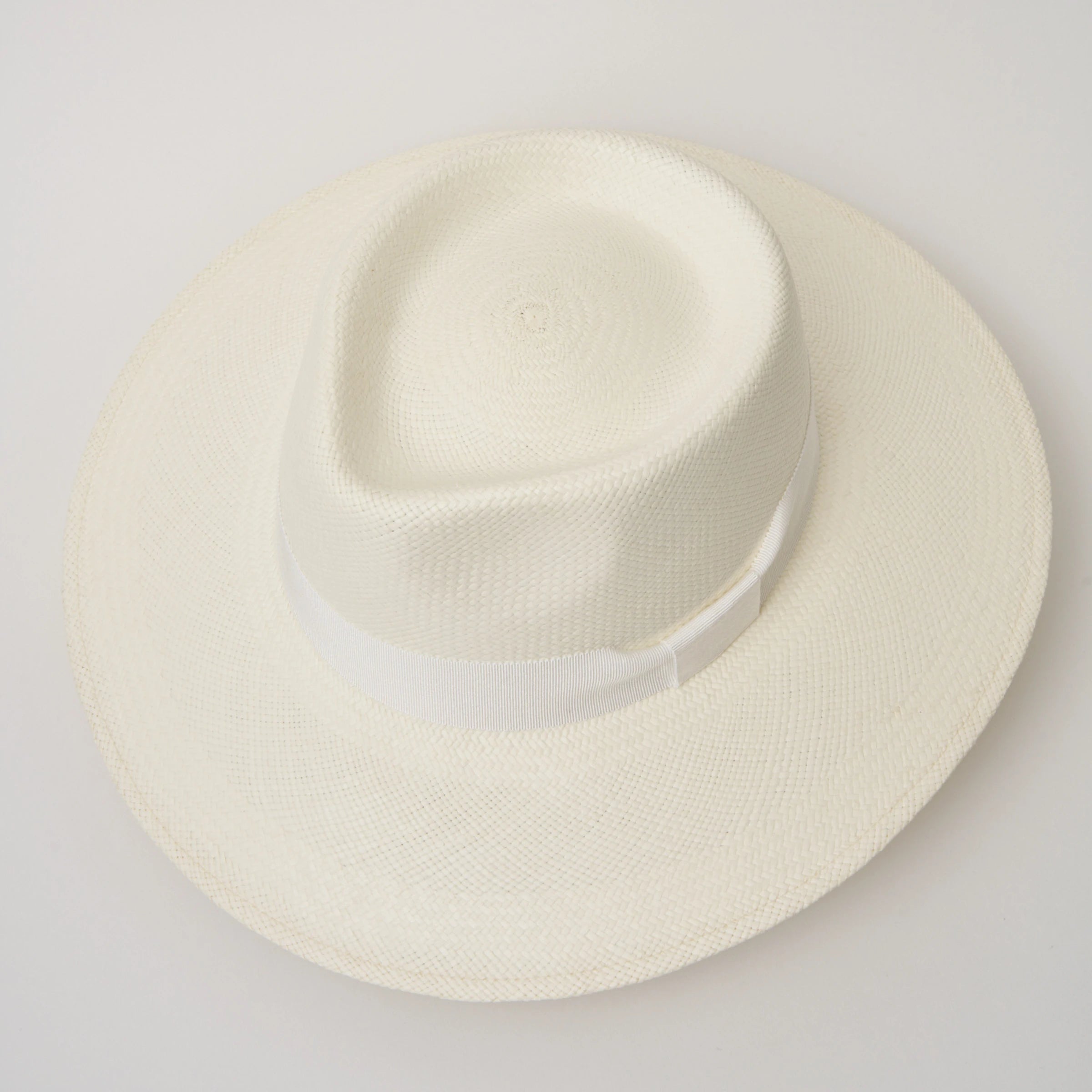 Studio image, taken looking down at the Camilo Country Cream coloured Panama Hat with White trim, showing the crown shape and pinch.