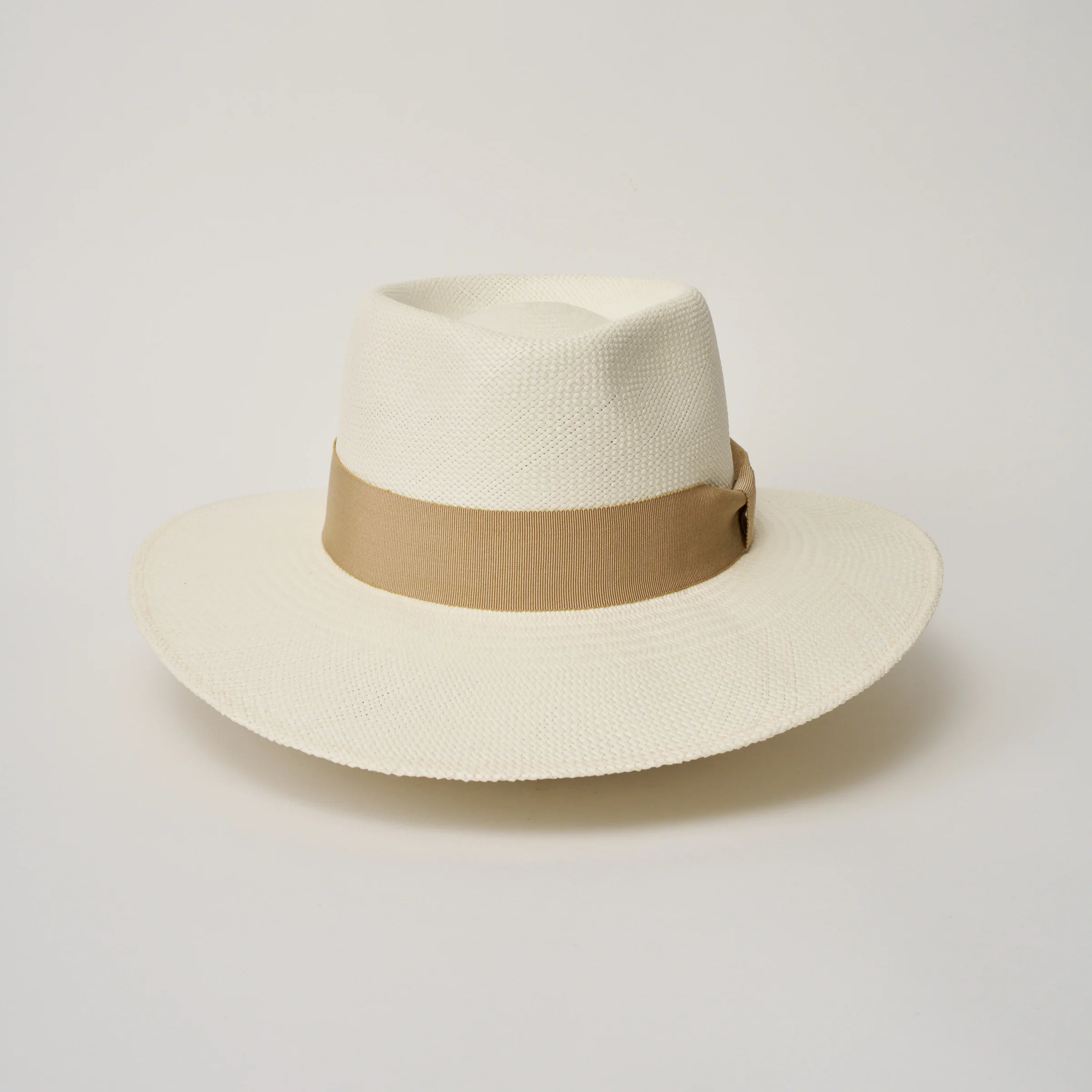 Studio image of the Camilo Country Cream coloured Panama Hat with Camel trim taken from the front showing pinch and brim.