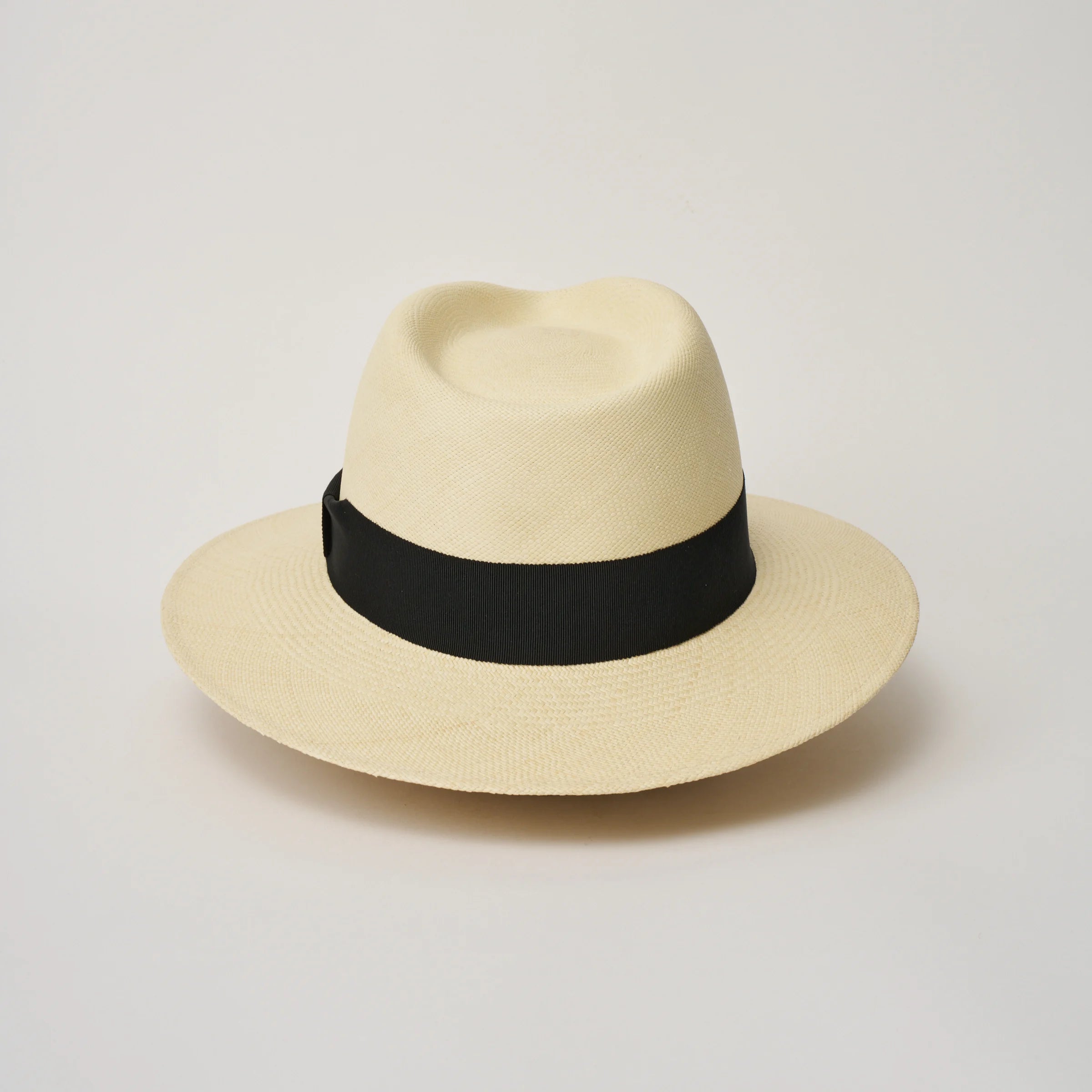 Studio image of the Camilo Executive Fino Natural coloured Panama Hat with Black trim taken from the back.