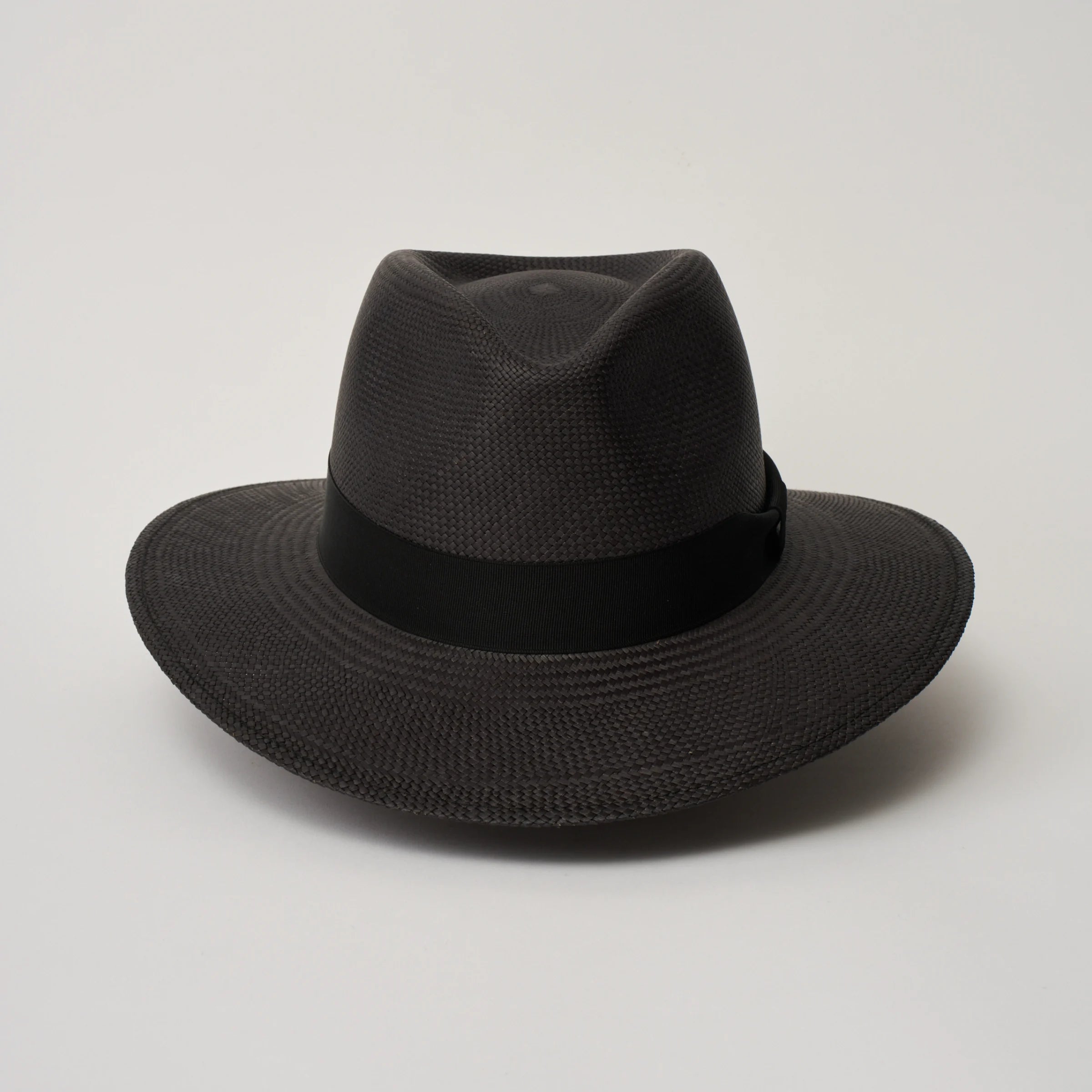 Studio image of the Camilo Executive Black coloured Panama Hat with Black trim taken from the front, showing pinch.