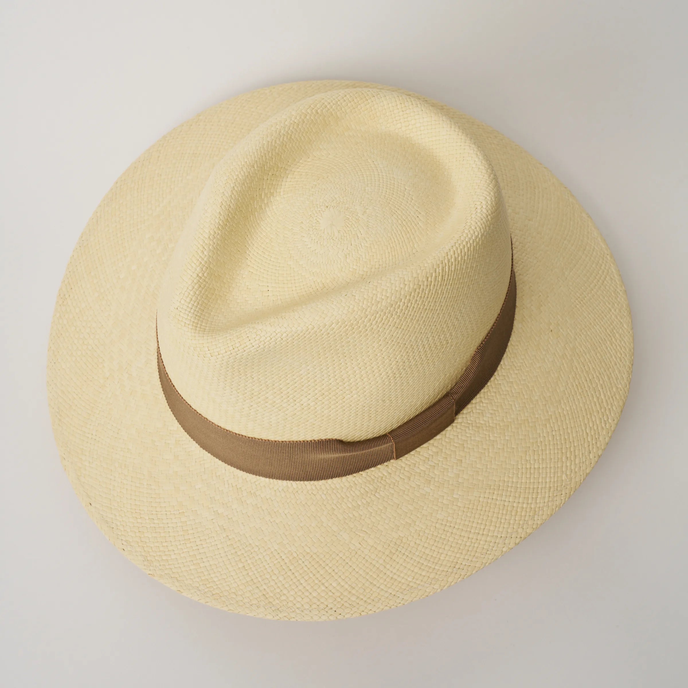 Studio image, looking top-down on the Camilo Executive Natural coloured Panama Hat with Oat trim, showing the crown shape.