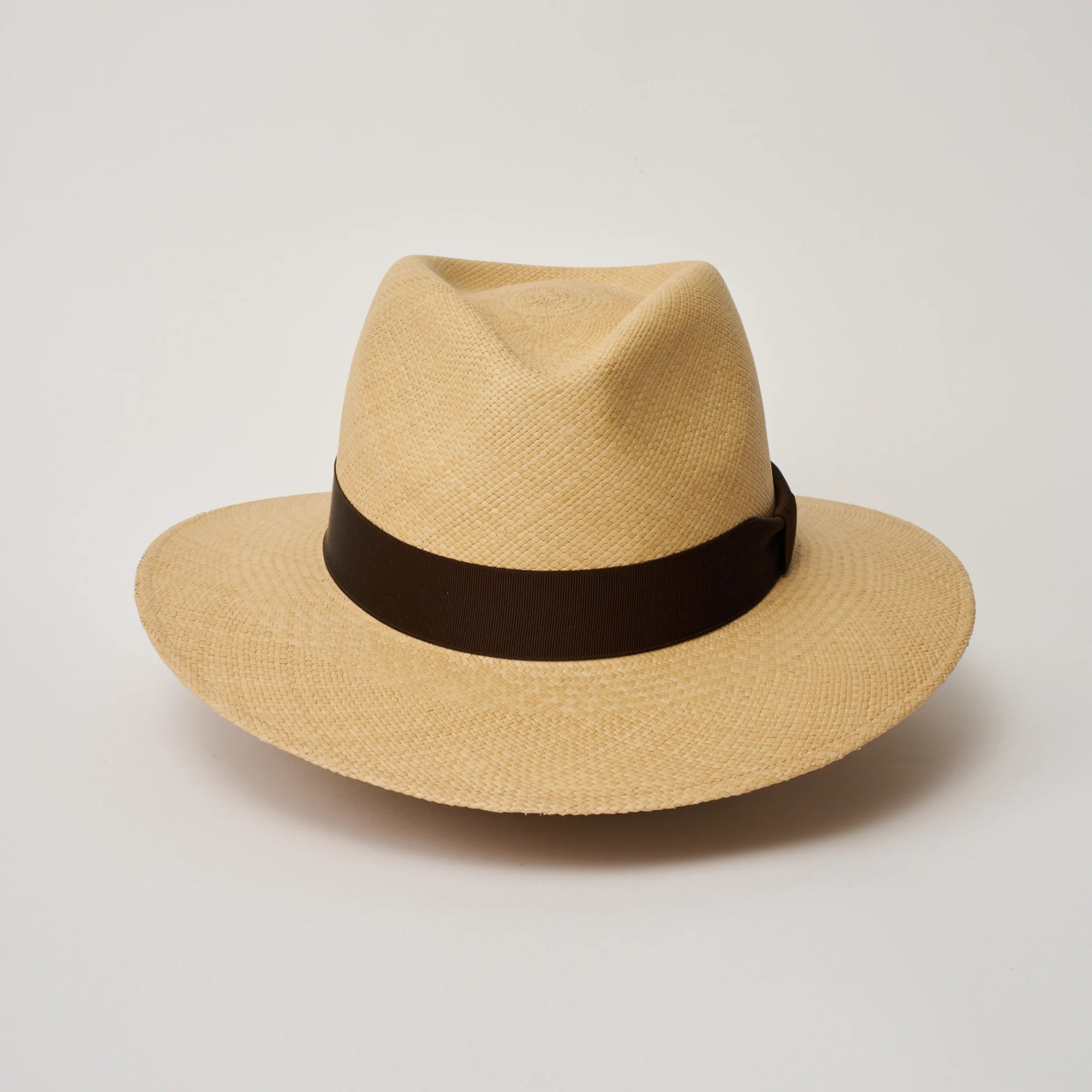Studio image of the Camilo Executive Sand coloured Panama Hat with Caffe trim taken from the front, showing pinch.