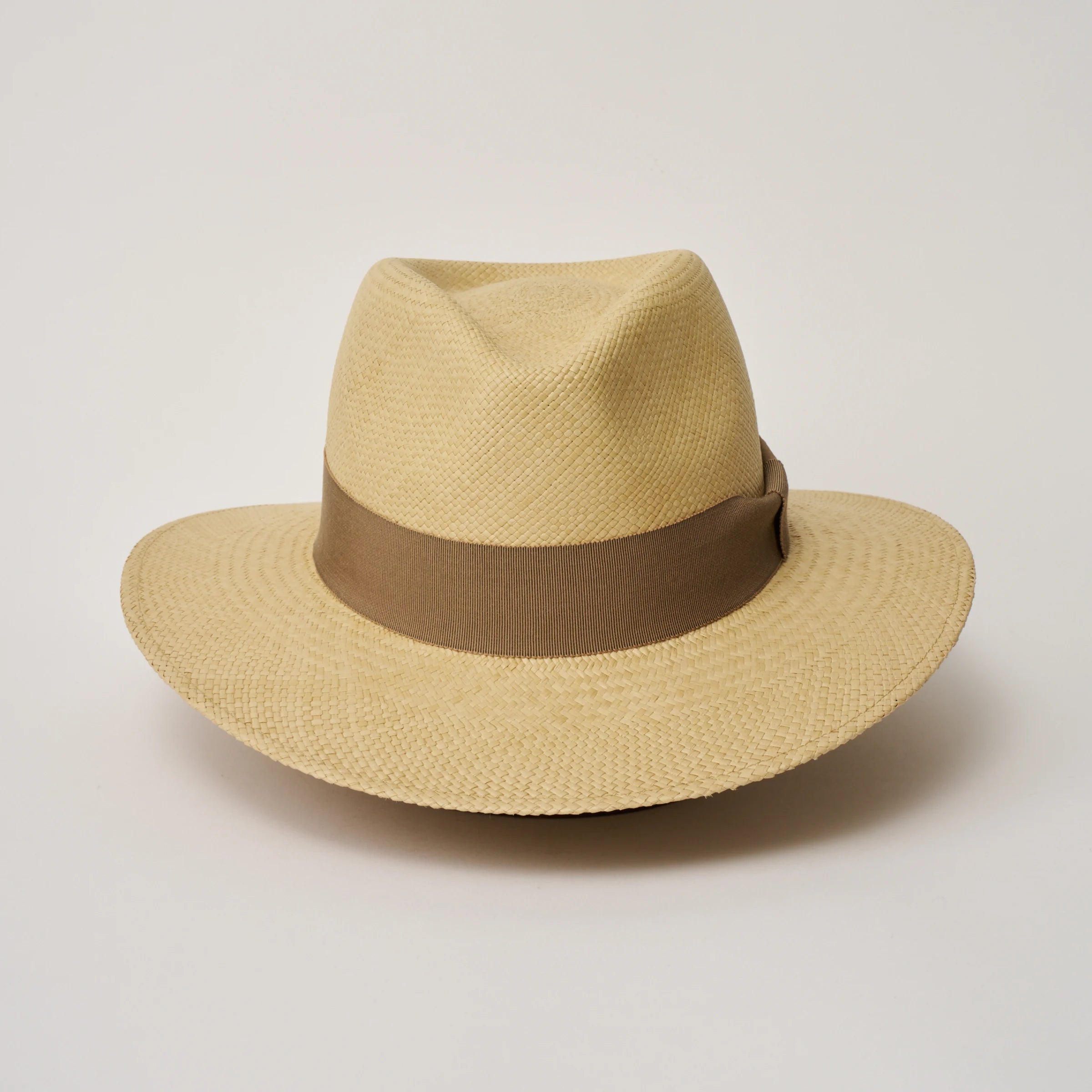 Studio image of the Camilo Executive Sand coloured Panama Hat with Oat trim taken from the front, showing pinch.