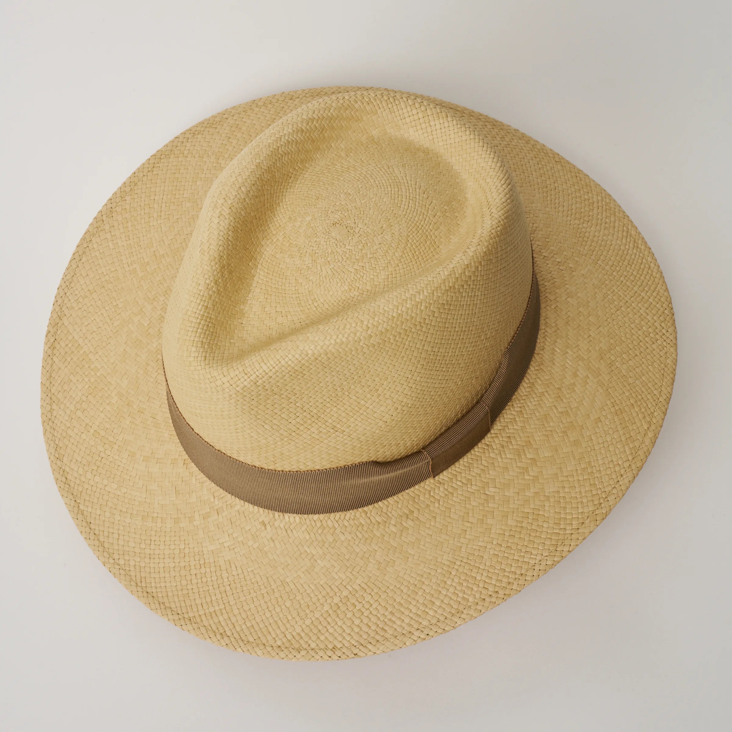 Studio image, looking top-down on the Camilo Executive Sand coloured Panama Hat with Oat trim, showing the crown shape.