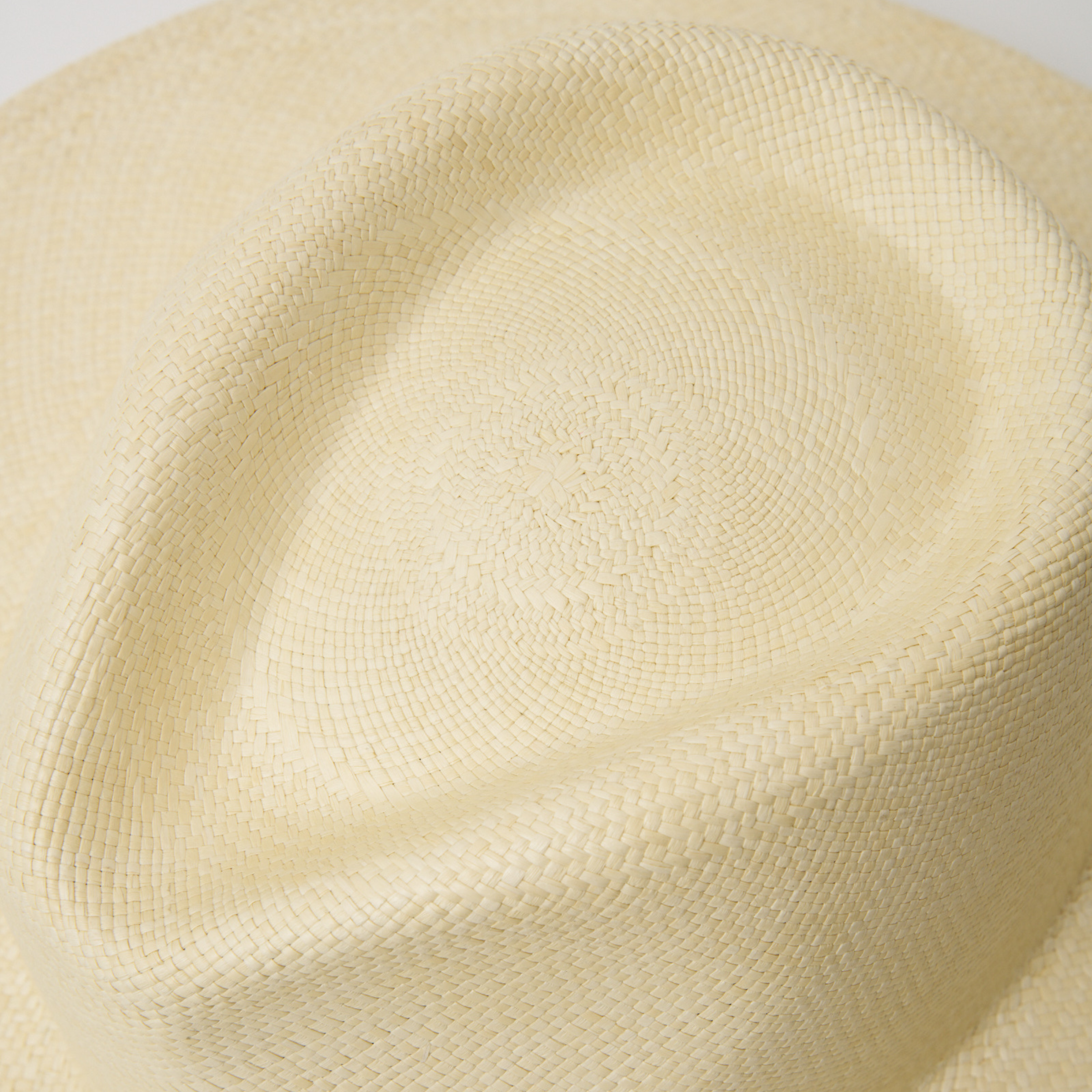 Studio closeup image of the top of the crown on the Natural coloured Camilo Oro Panama hat.
