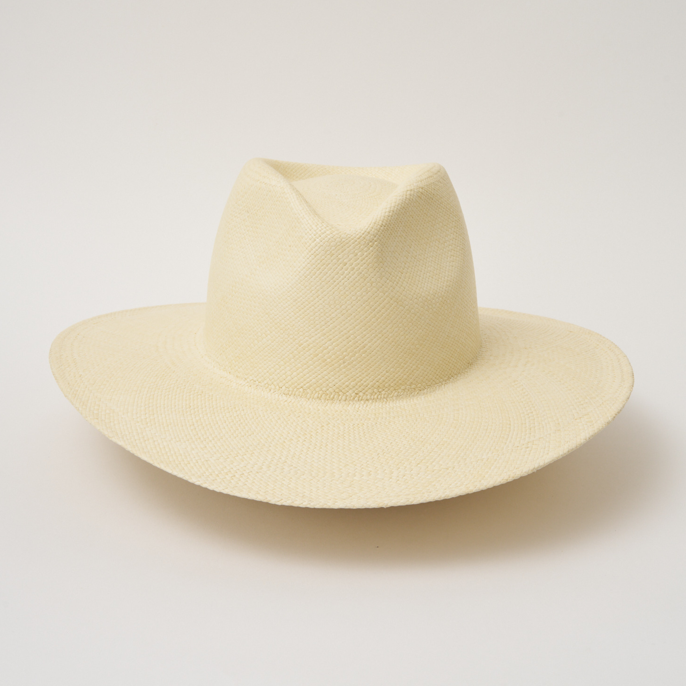 Studio image of the Camilo Oro Natural coloured Panama Hat taken from the front showing pinch and brim.